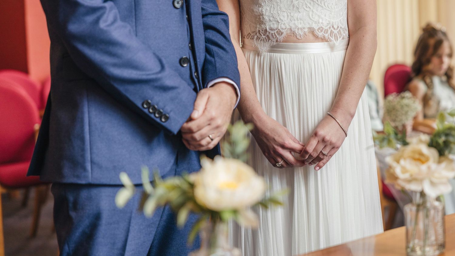 Bride and groom sharing a romantic moment on their wedding day, captured in a relaxed documentary style by EvieSJPhotography.