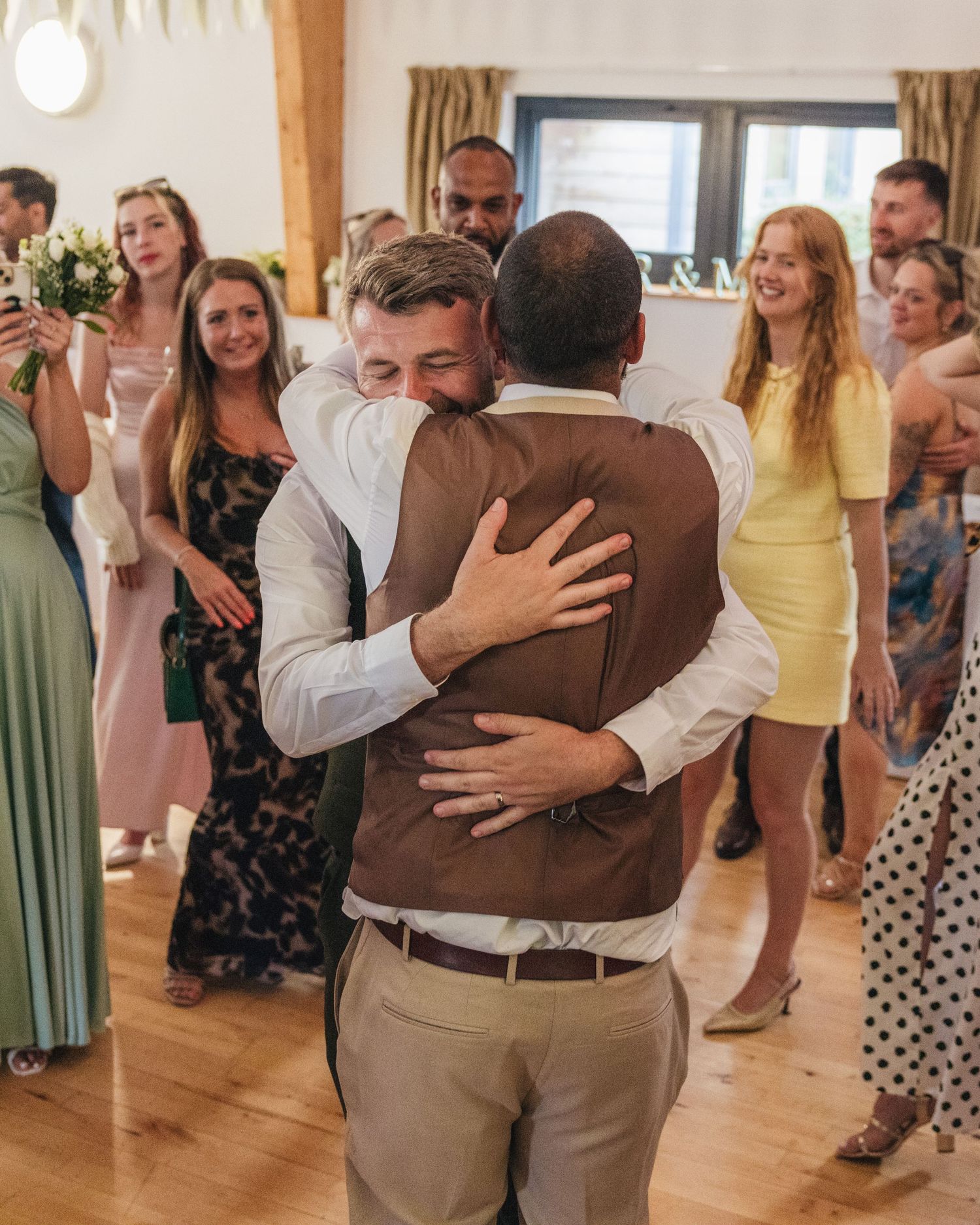 Jack and Aaron sharing a drunken embrace on the dance floor at Rock Village Hall in Worcestershire.