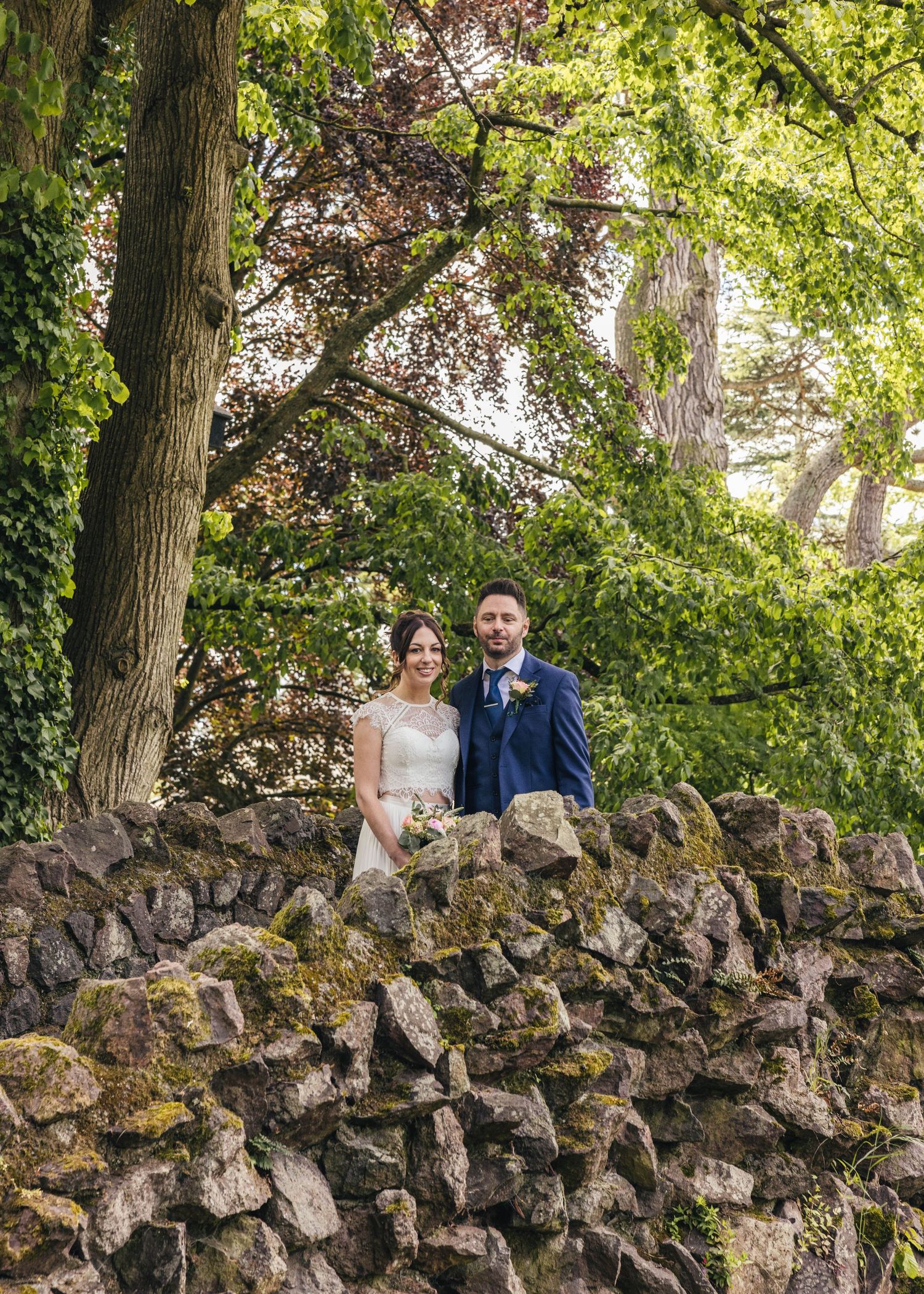 Bride and groom sharing a romantic moment on their wedding day, captured by EvieSJPhotography.
