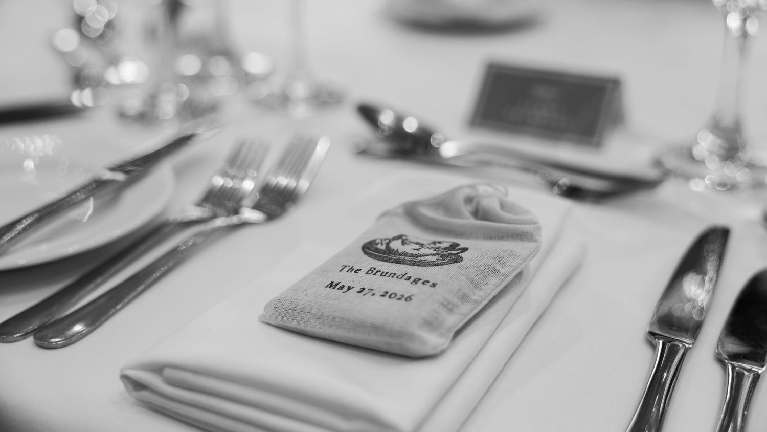 Wedding breakfast decoration set-up in black and white, captured by EvieSJPhotography.