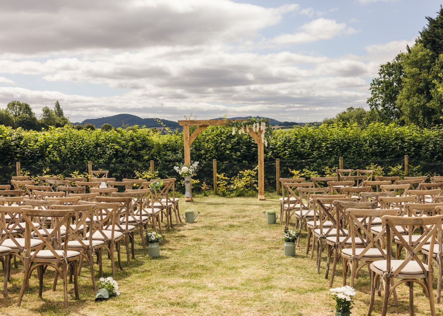 A wide angle photo of the outdoor ceremony space at Rock Village Hall in Worcestershire.