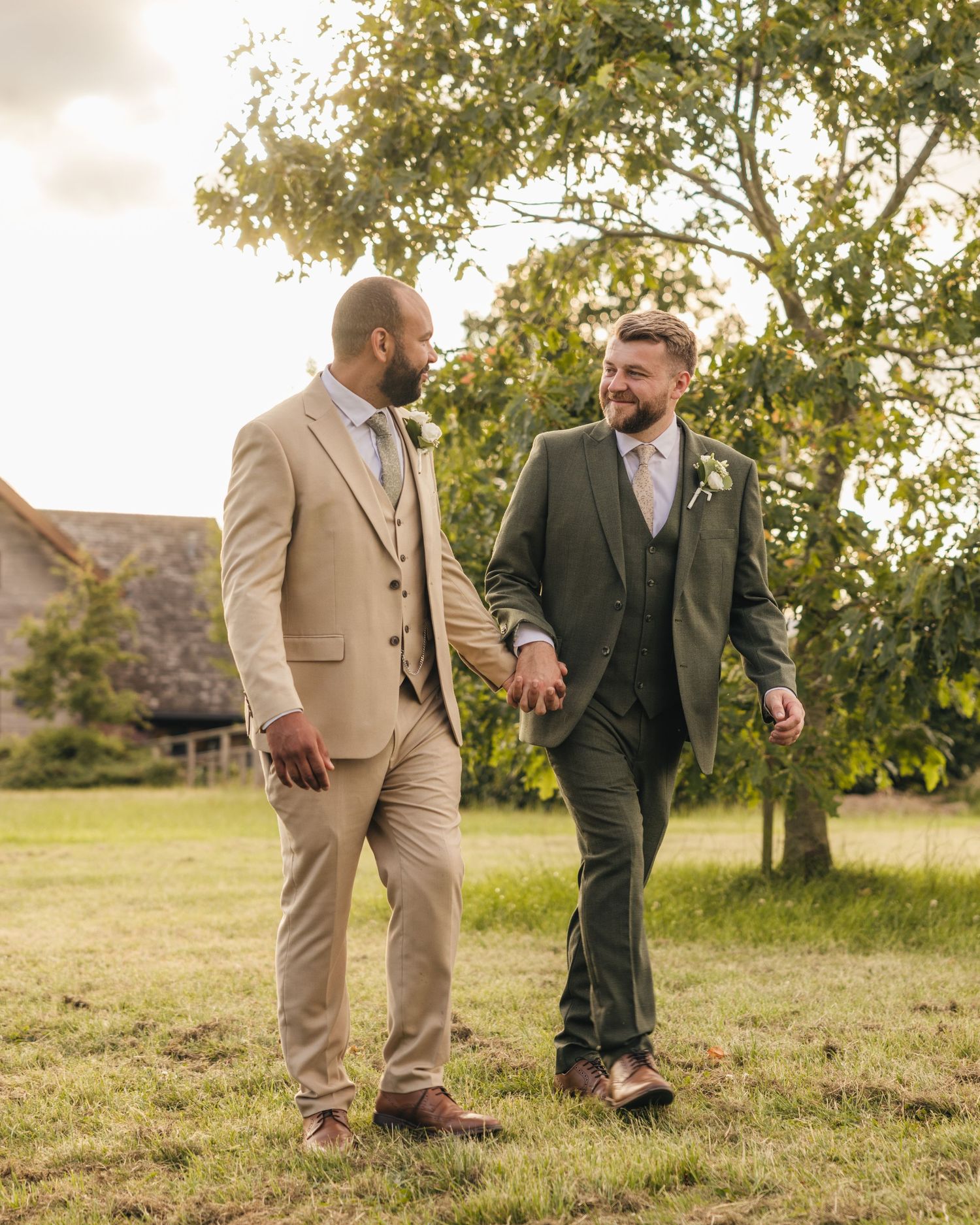 Aaron and Jack share a quiet moment together during golden-hour wedding portraits.