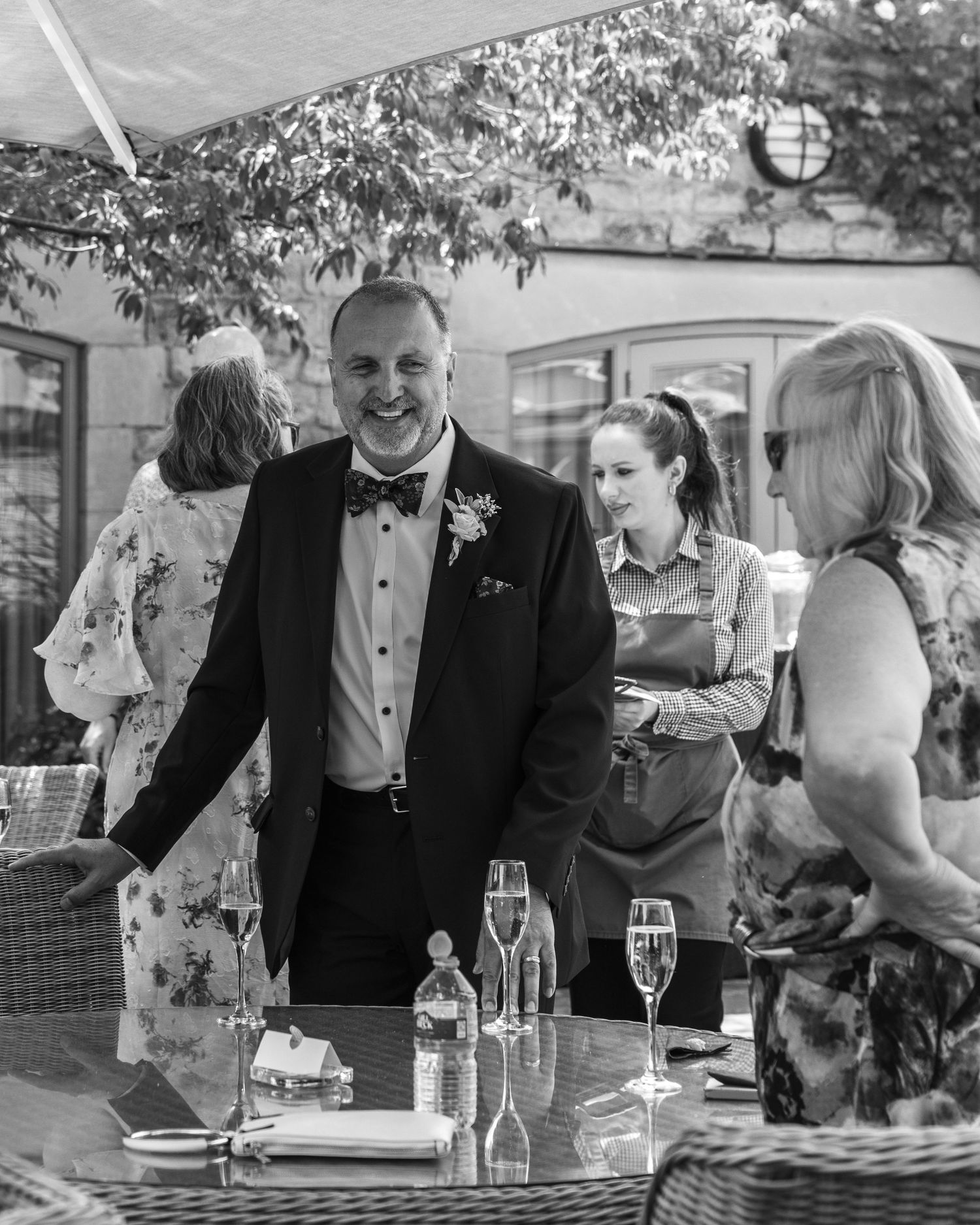 Wedding guest enjoying a drink at the wedding drinks reception.