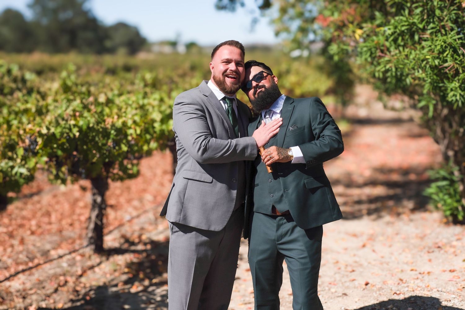 A series of candid groomsmen photos showing joyful laughter and hugs outdoors in formal attire.