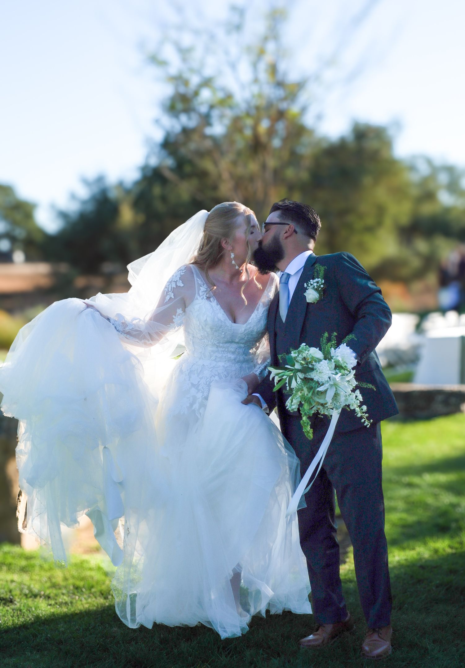 A romantic wedding couple shares an intimate dip pose on a grassy lawn in a series of four connected photos.
