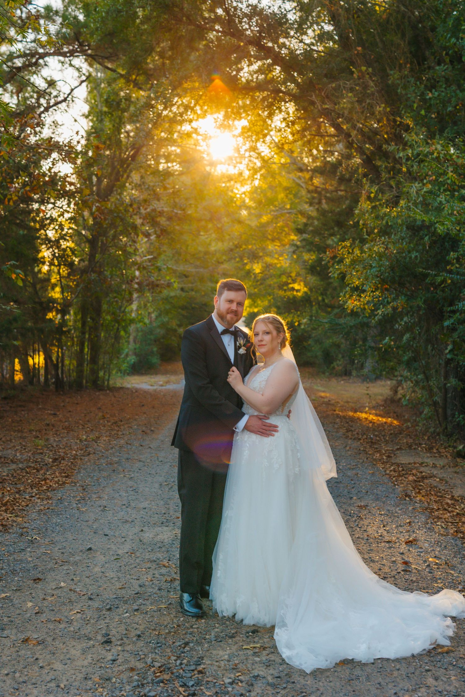 East Texas wedding photographer photographing bride and groom at sunset in Longview.