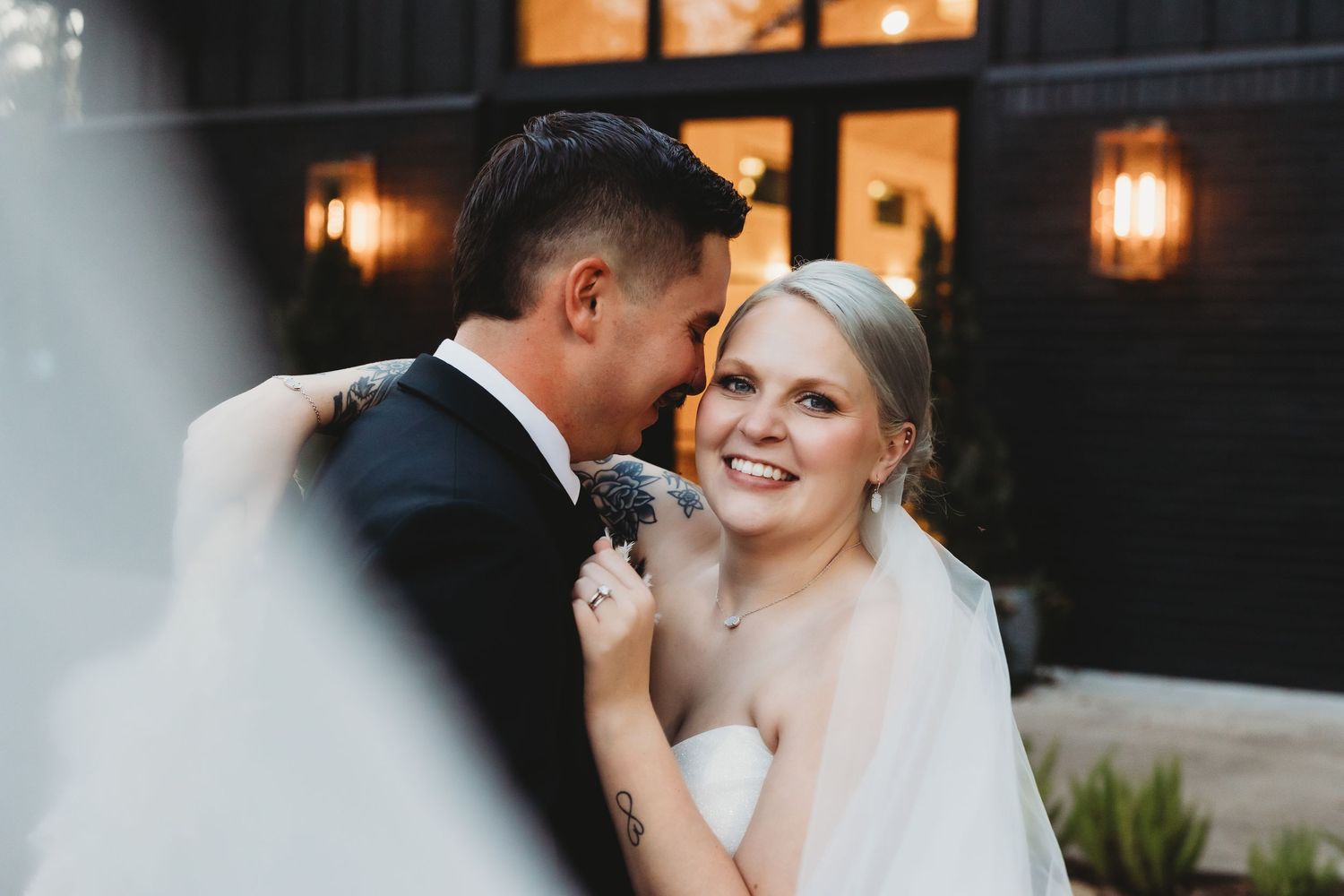 East Texas wedding photographer photographing newlyweds during sunset