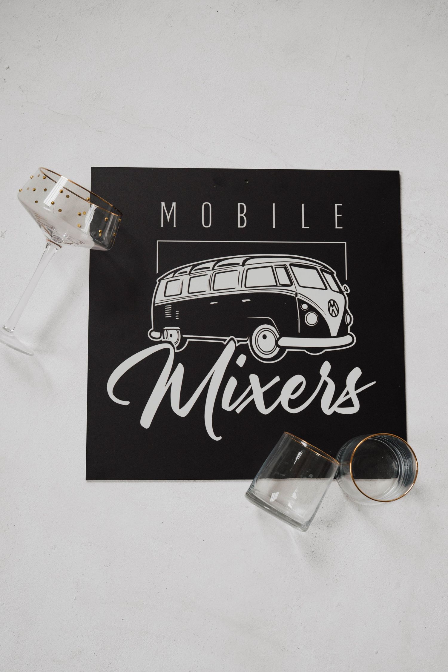 Black and white Mobile Mixers logo design featuring vintage VW van illustration.