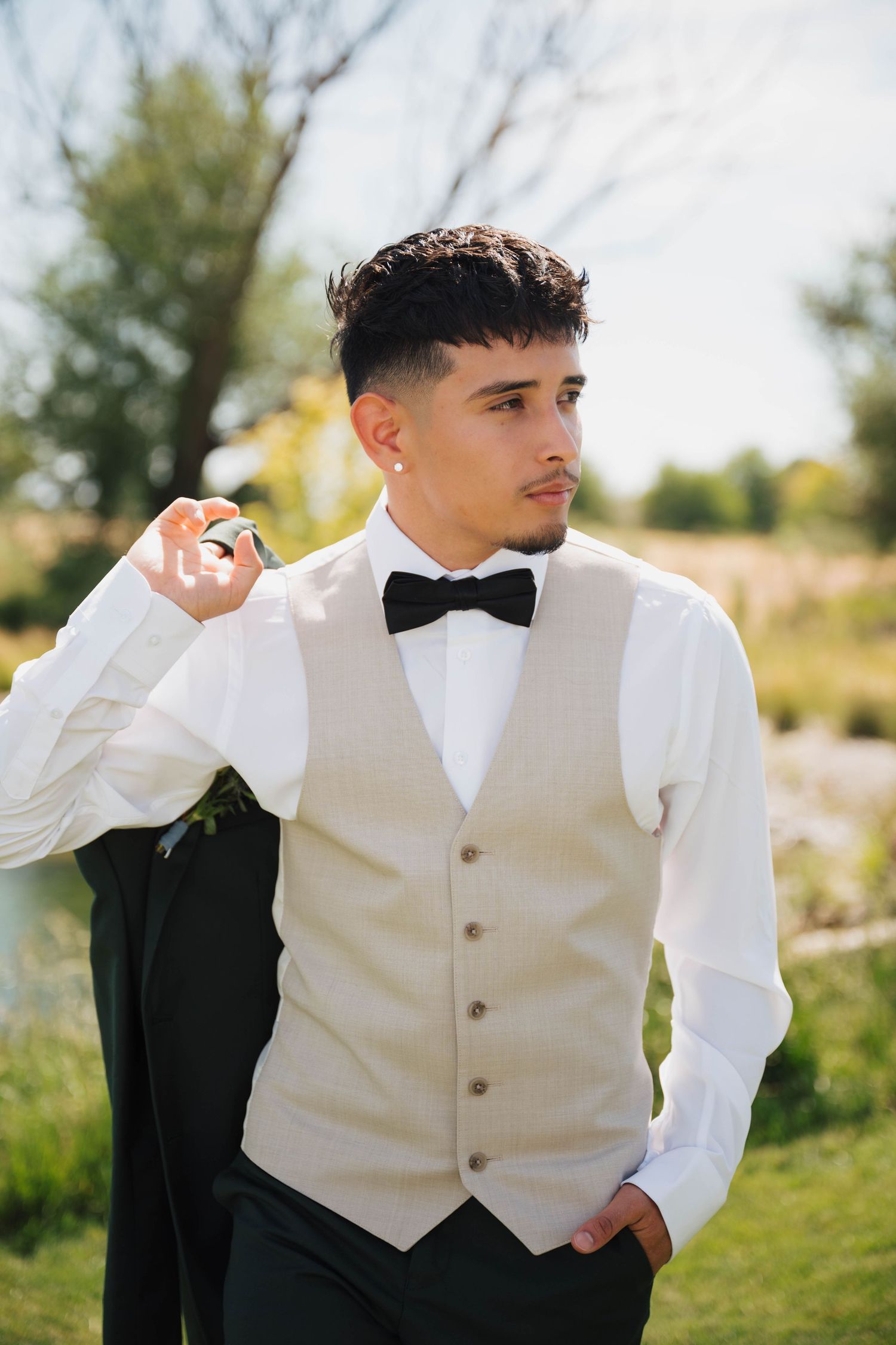 Groom portrait at Rustic Daisy Event Barn in Nampa, Idaho before his wedding ceremony.
