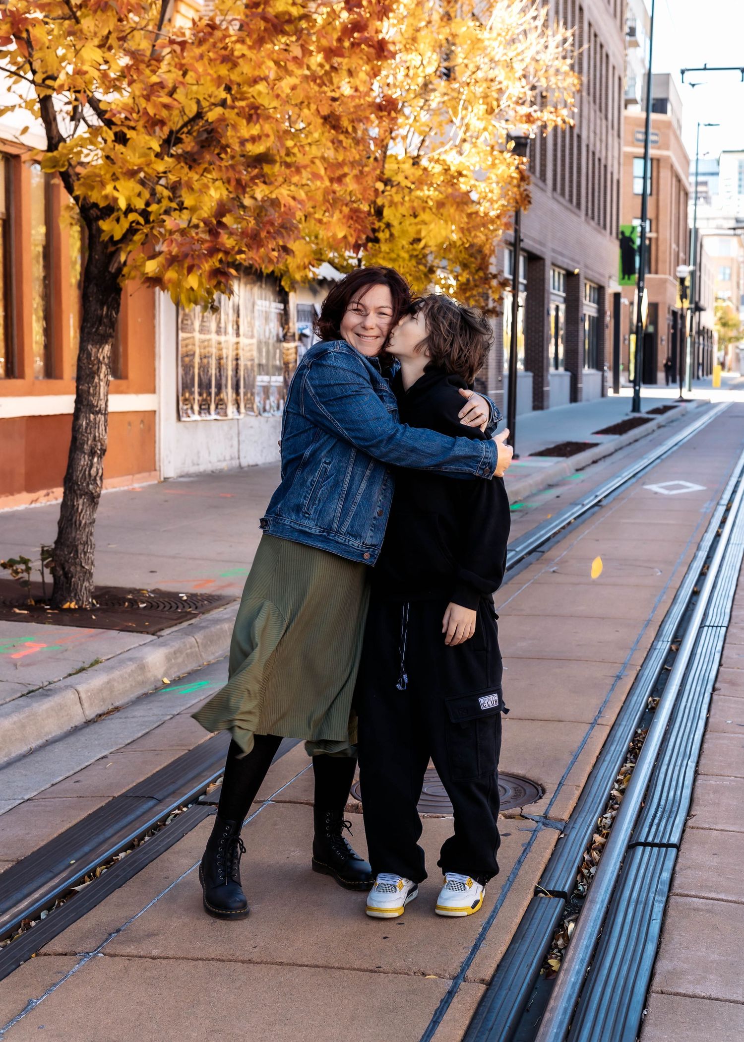 Candid family photography in downtown Denver by Wild Light Studio featuring natural light and city architecture.