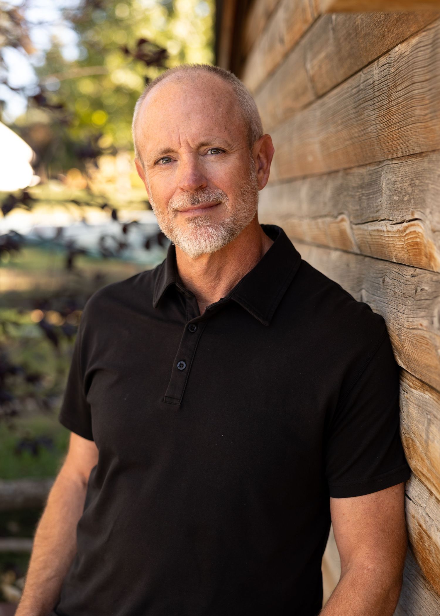 Professional headshot of c level executive for construction company outside in natural light. Arvada, CO