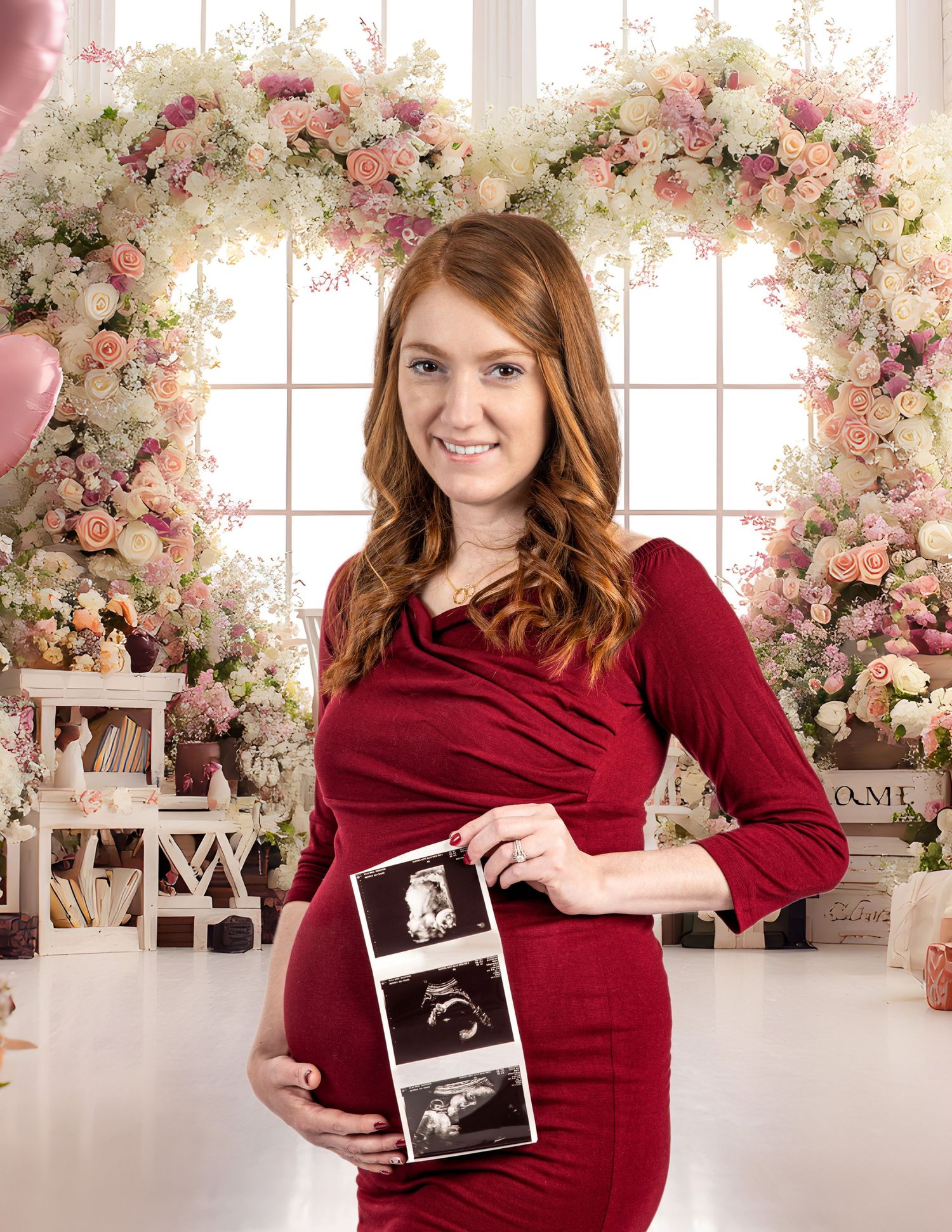 Maternity studio session Waukesha Wisconsin, flowers, studio and showing ultrasound images.   Red dress bringing out the beauty