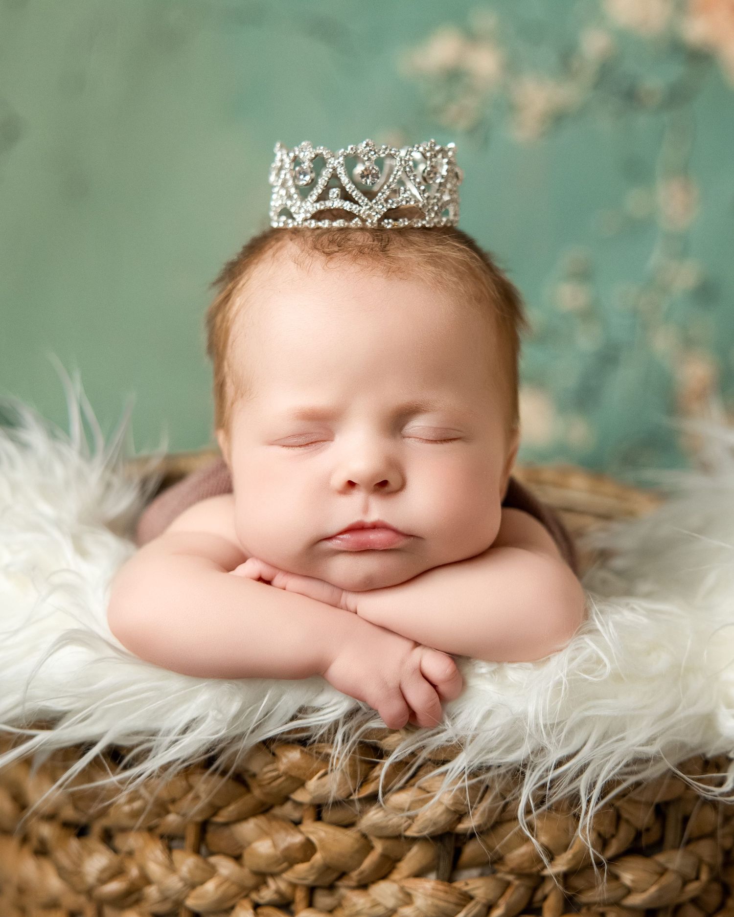 Waukesha newborn portrait at Lake Country Photography. Sleeping baby with crown, creating warm, heartwarming, and timeless imagery.
