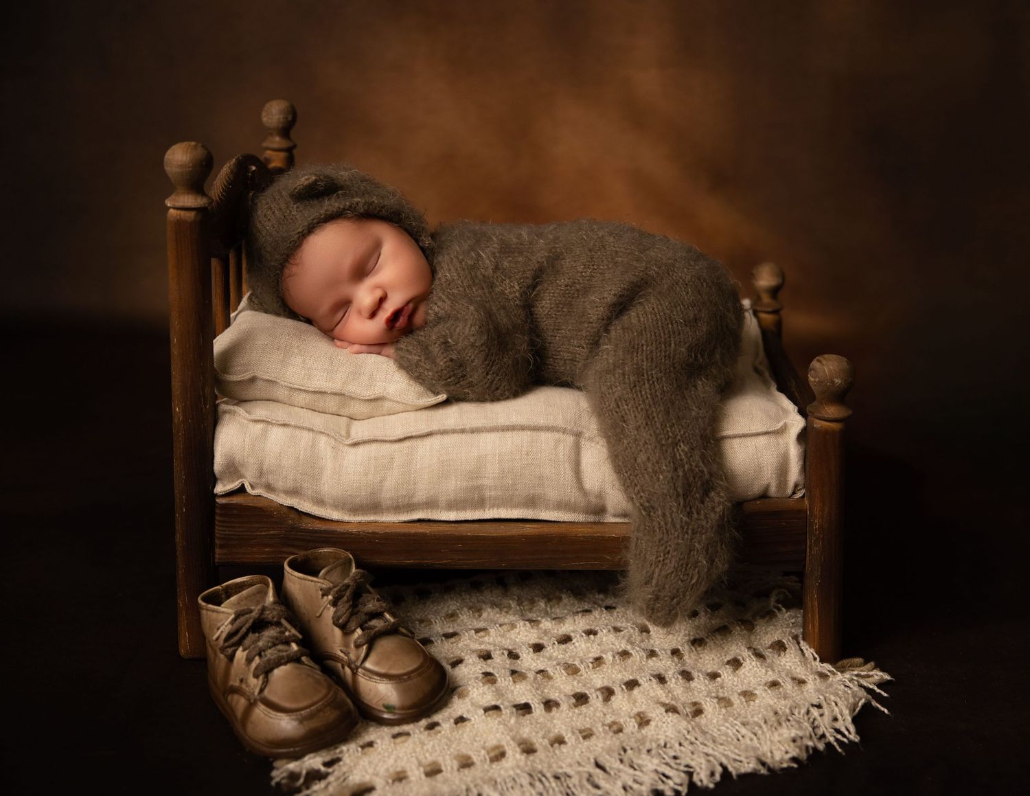 Sleeping newborn in downtown Waukesha at Lake Country Photography. Soft, cozy, and timeless newborn portraits to cherish forever.