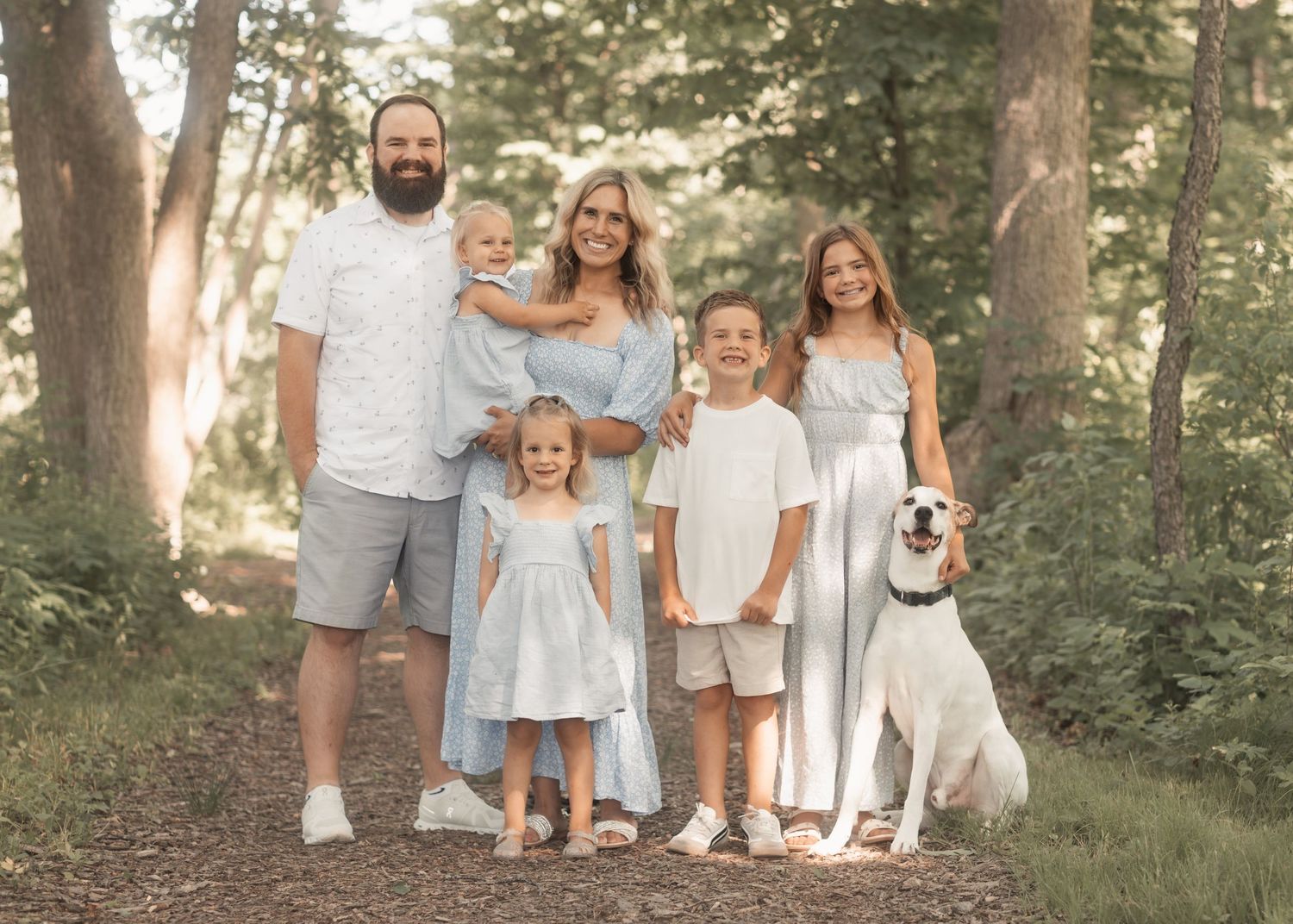 Family with their dog enjoying Menomonee Park, Waukesha. Warm, joyful, and timeless family photography capturing love and connection.