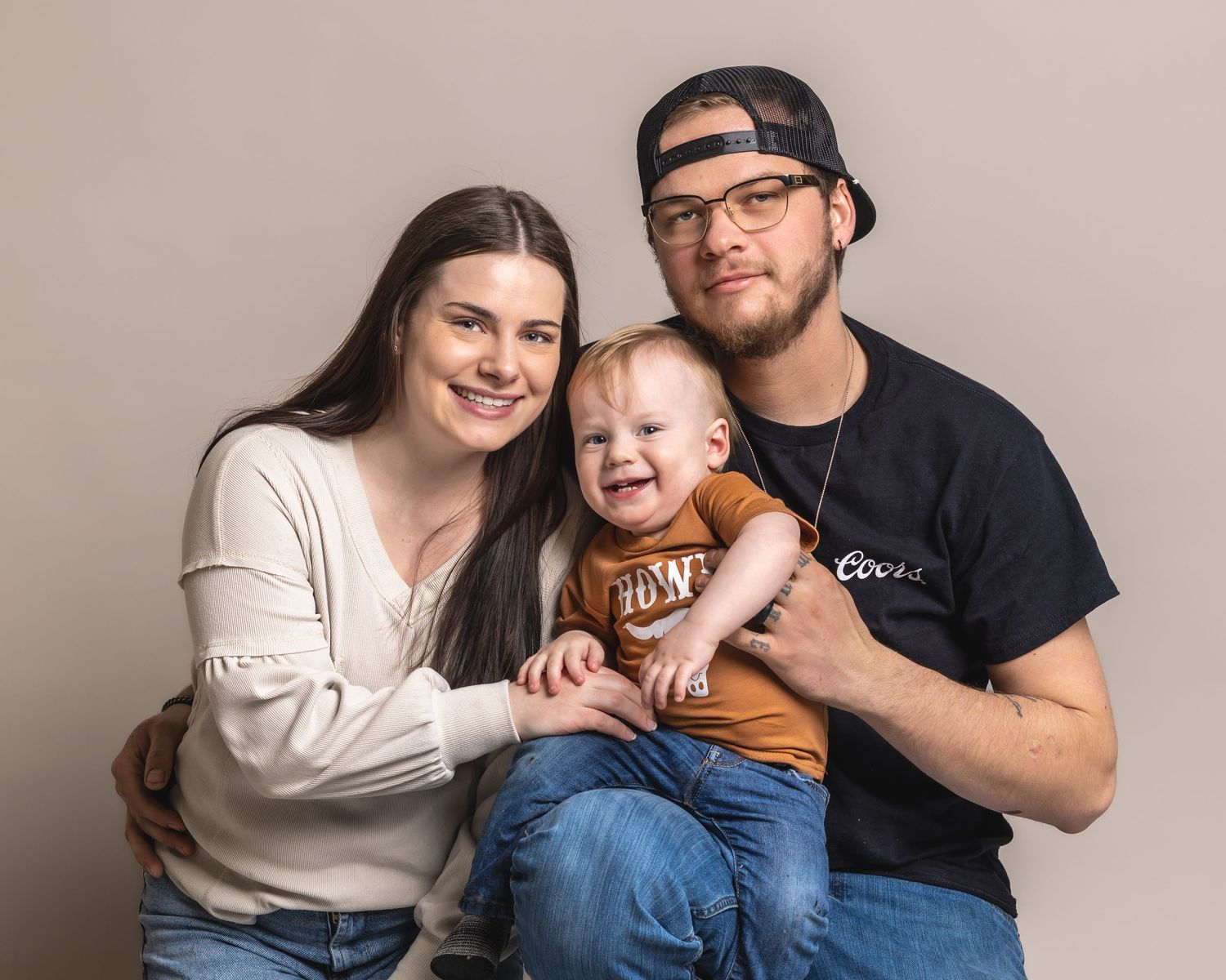 Waukesha studio family photography. Elegant, sharp image of three family members in a comfortable, relaxed session full of warmth.