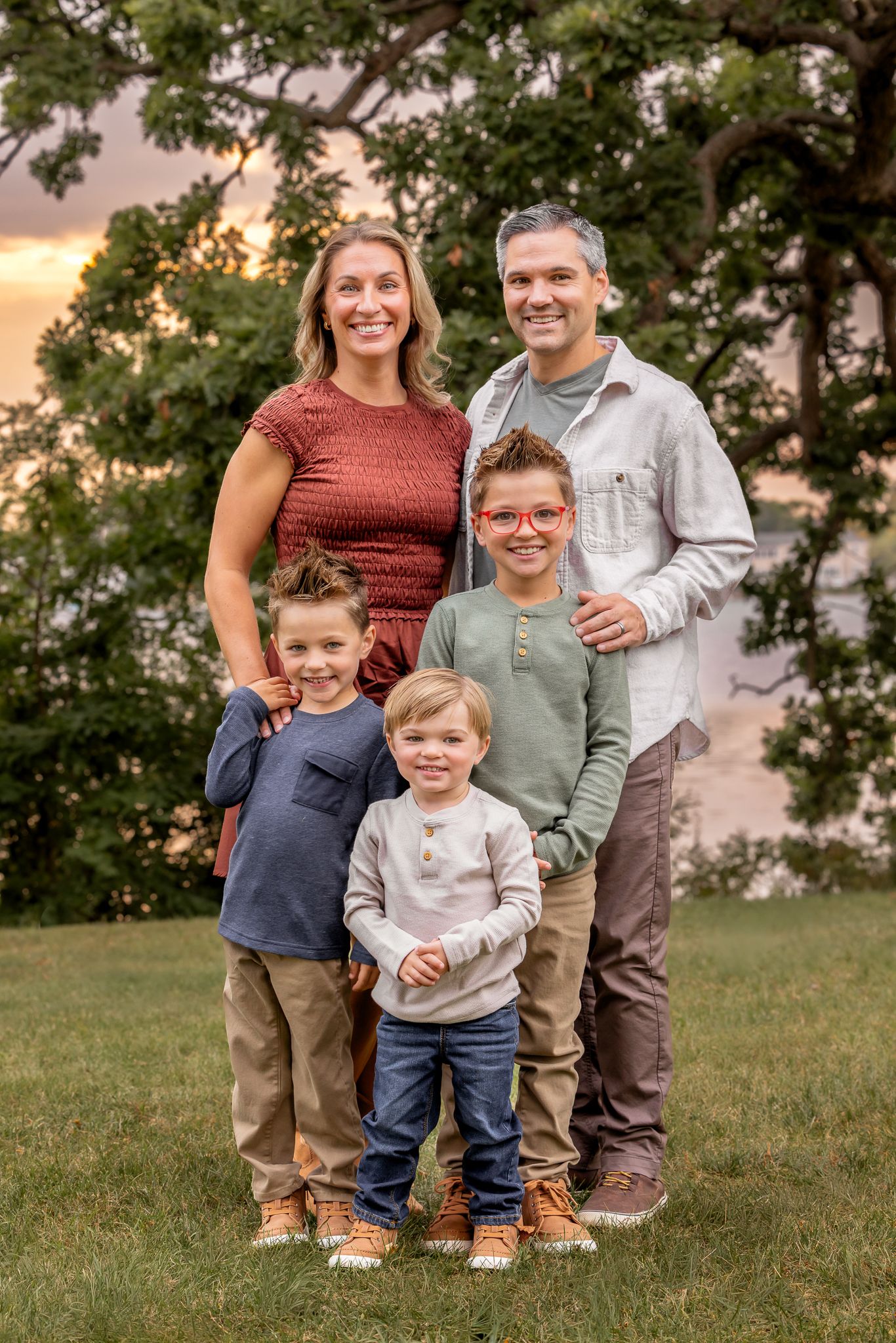 Fall family session at Fowler Lake Park, Oconomowoc. Vibrant, joyful portraits of a family of 5, all smiling, captured in warm outdoor light