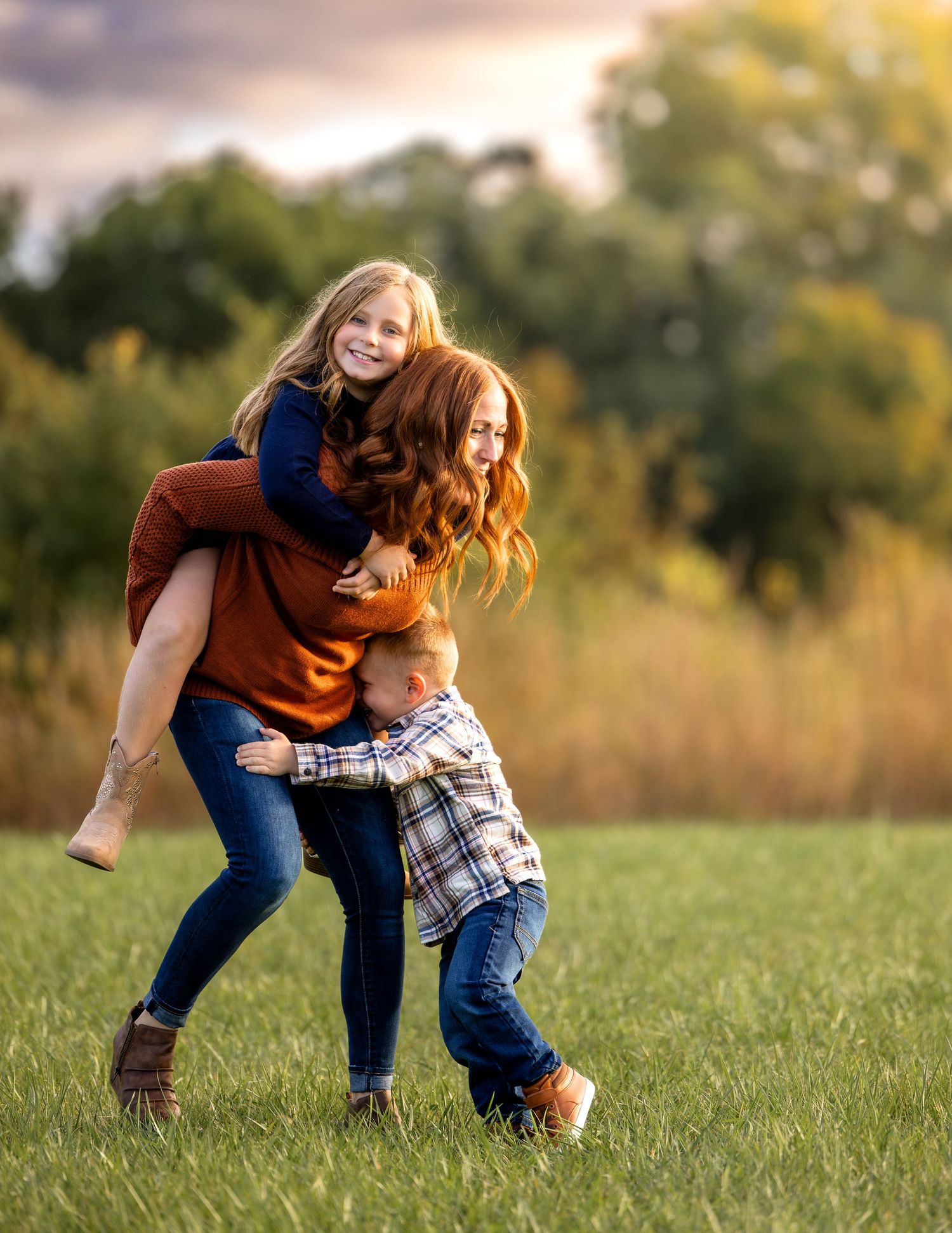 Mother and two kids in a sunny fall field at Retzer Nature Center, Waukesha. Heartfelt, colorful, and natural family photography.