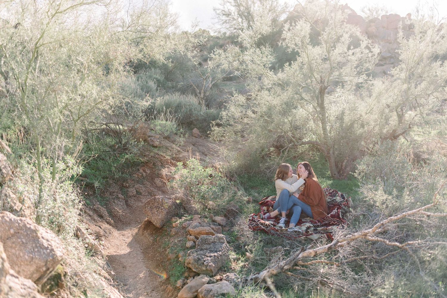 A series of photos showing a rocky desert trail winding through arid brush and terrain.