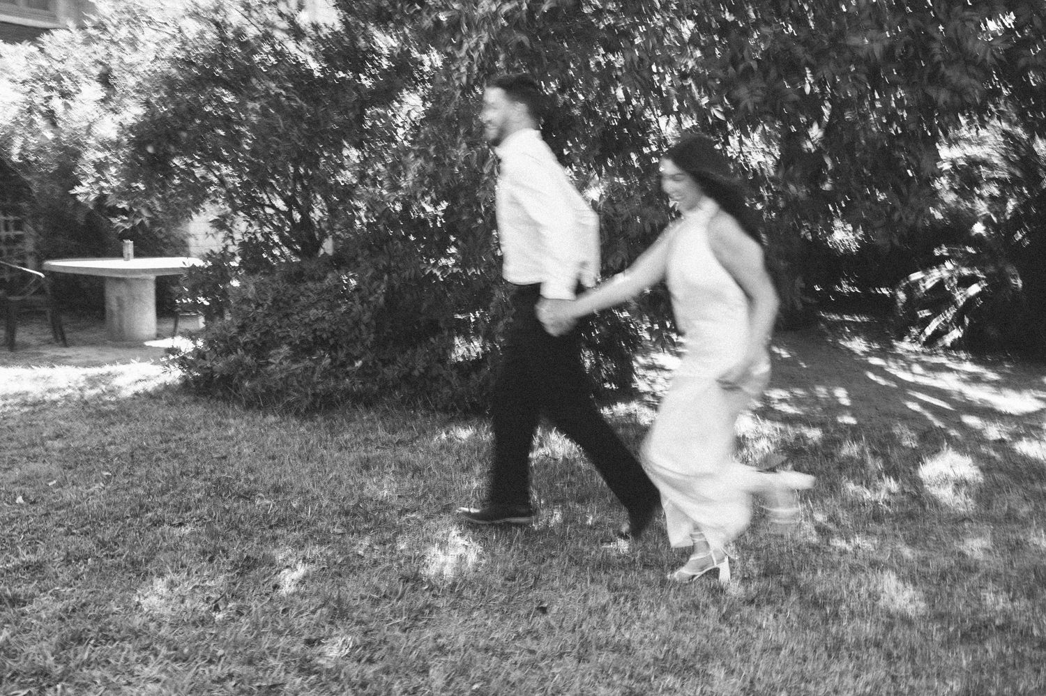 A series of black and white photos showing a couple in a romantic outdoor setting.