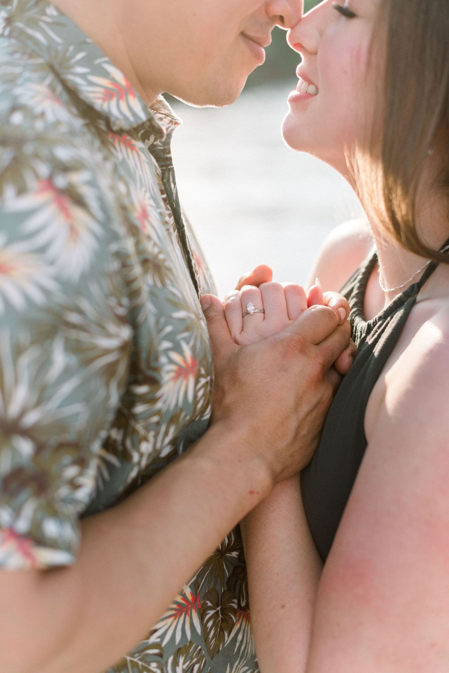 Close up of an intimate moment between a couple sharing a romantic embrace.