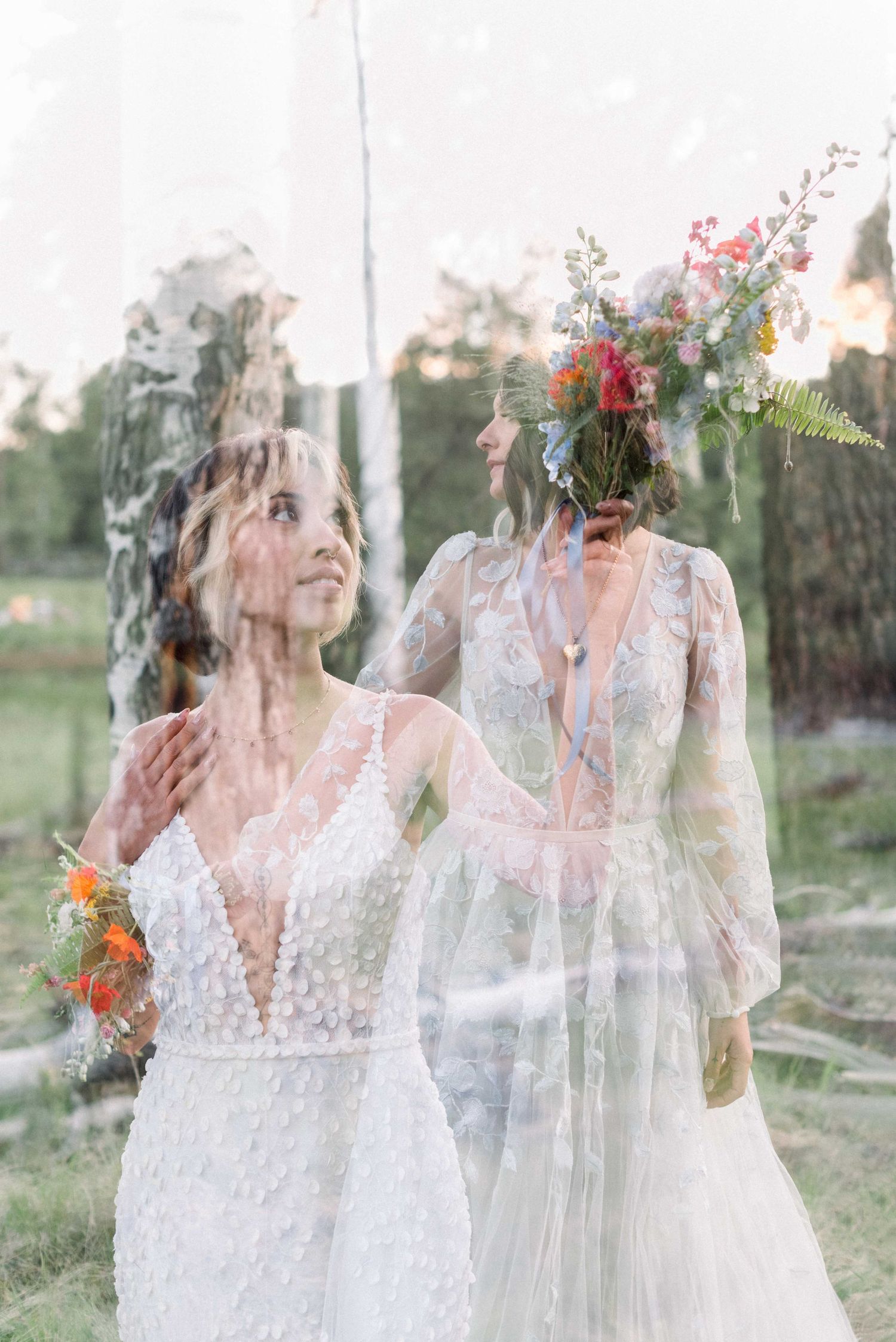 Wedding portrait with dreamy double exposure effect showing two people in white dresses with flowers.