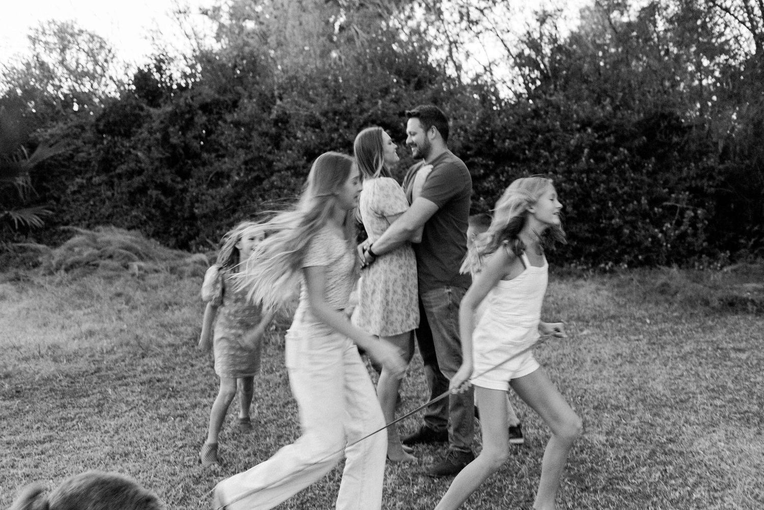 Natural light family photography sequence in outdoor garden setting.