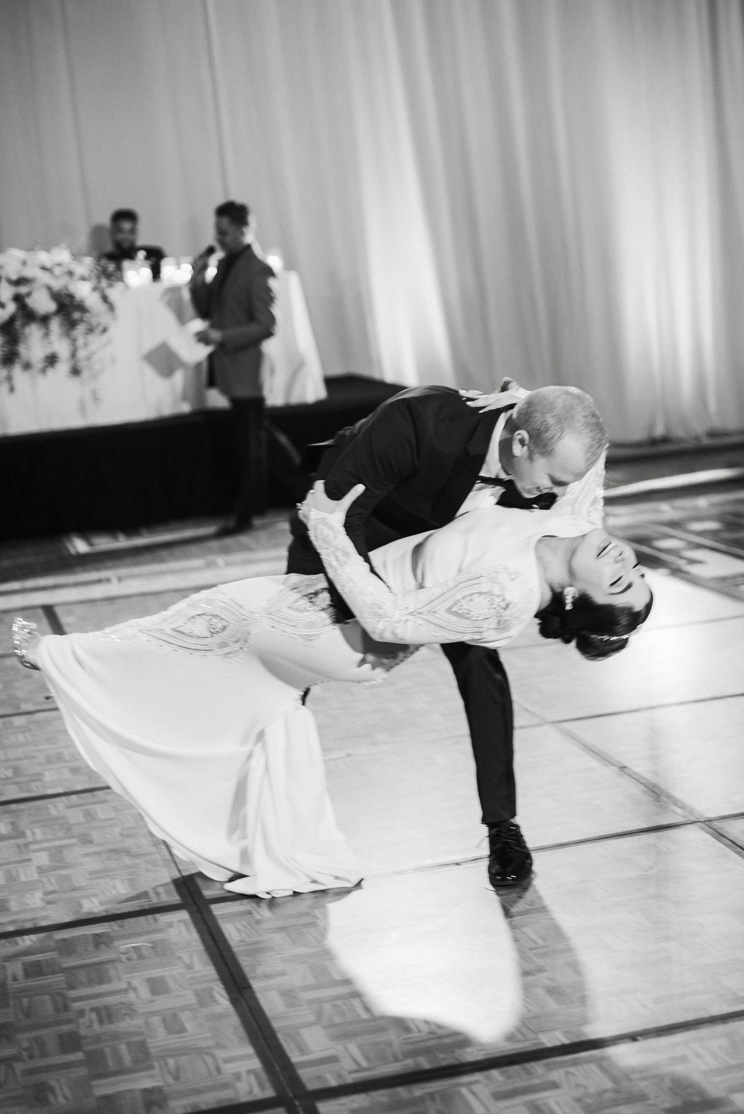Dramatic black and white dance sequence showing a wedding couple's first dance.