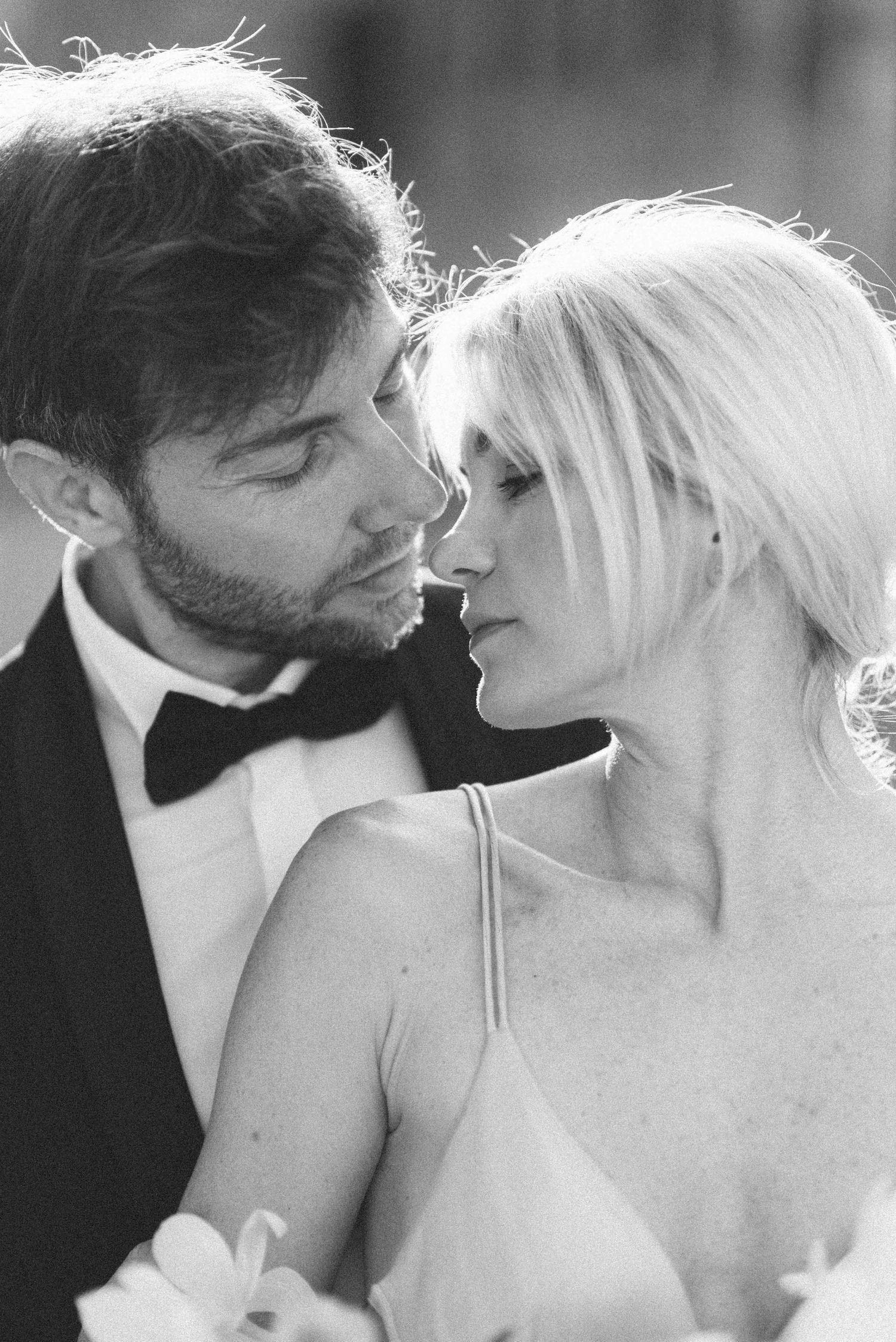 Intimate black and white portrait of couple in romantic pose.