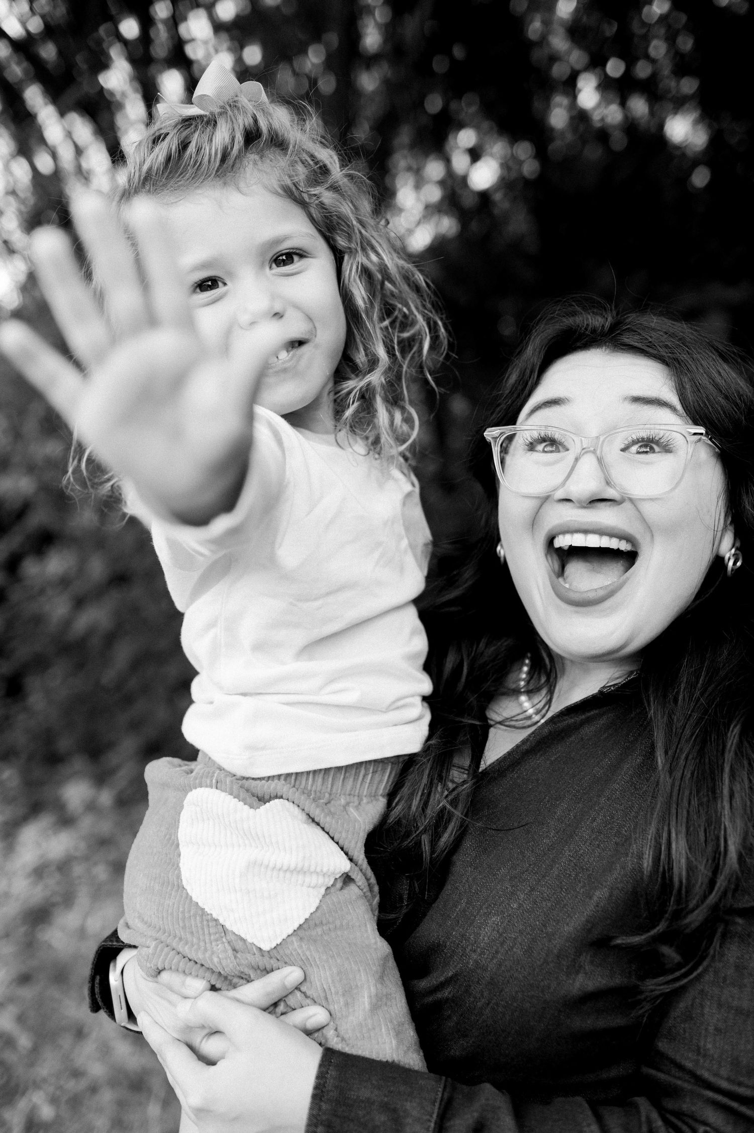 Black and white candid photos capturing joyful moments and laughter.