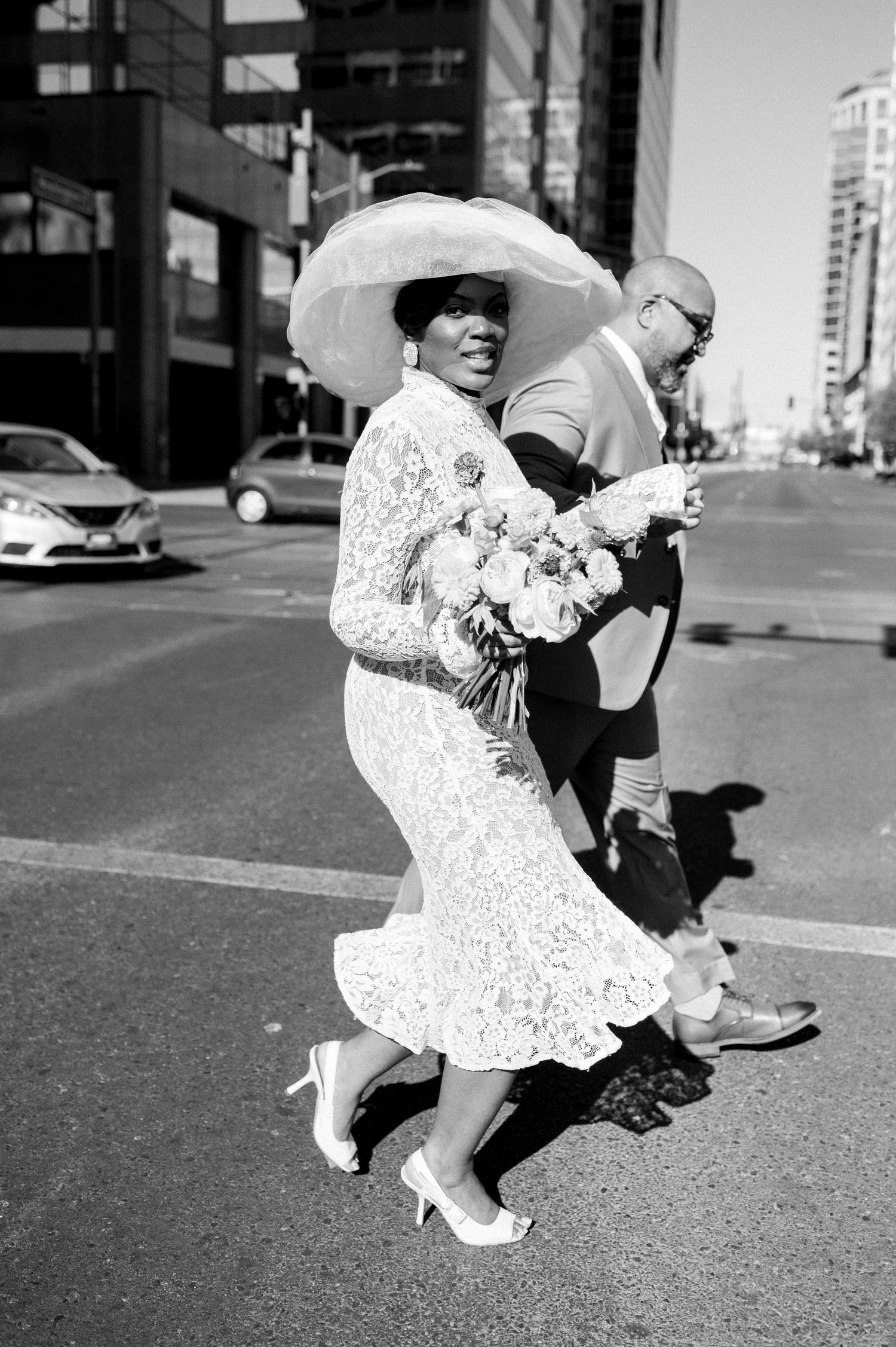 A sequence of black and white photos shows a couple dancing together on a city street, with the woman's dress flowing.