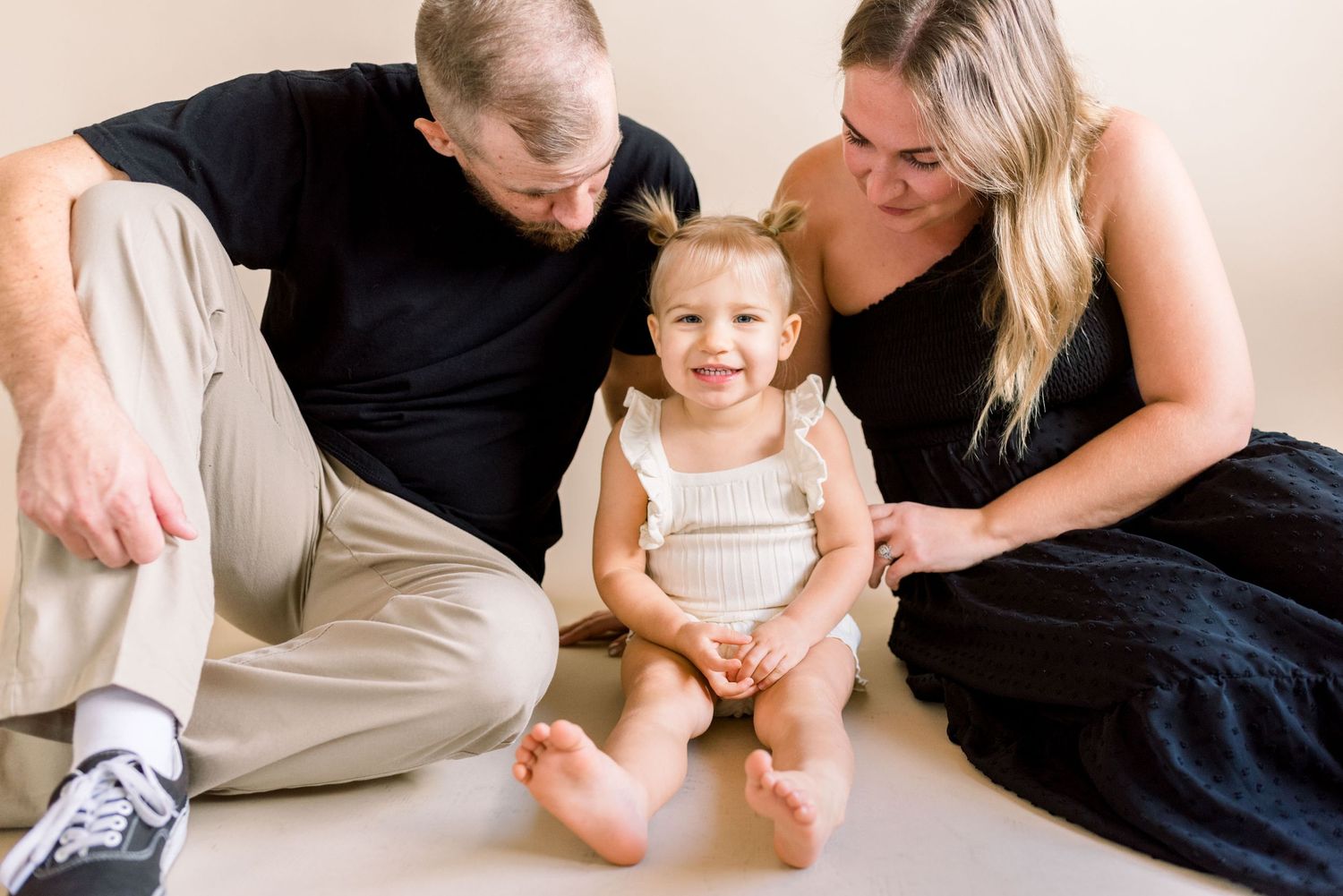 Casual family photo session capturing genuine smiles and laughter.