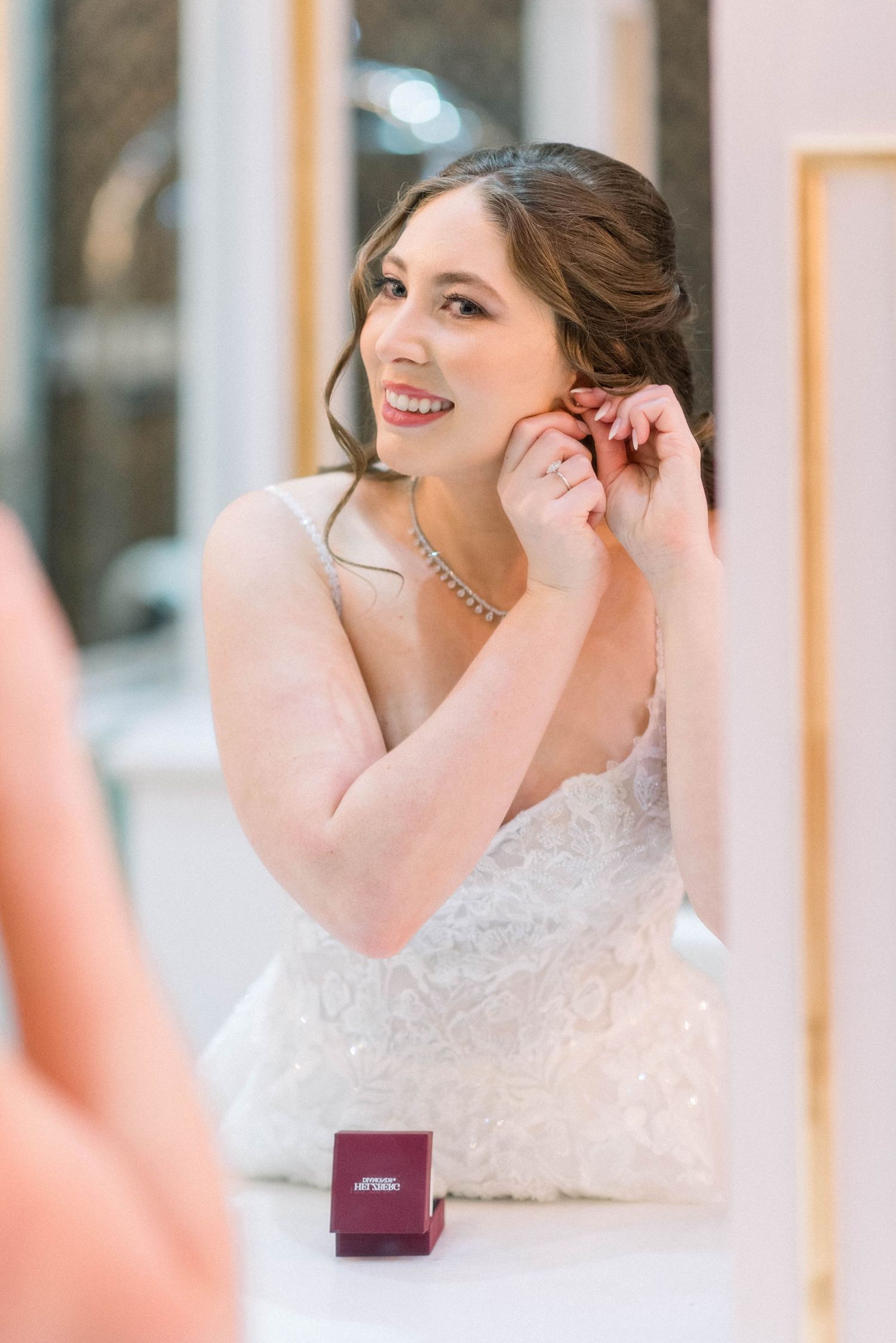 Wedding day preparation with jewelry box and elegant white decor.