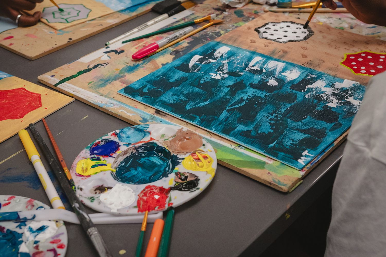 Close up shot of guests painting at a paint night event, captured by a Calgary event photographer
