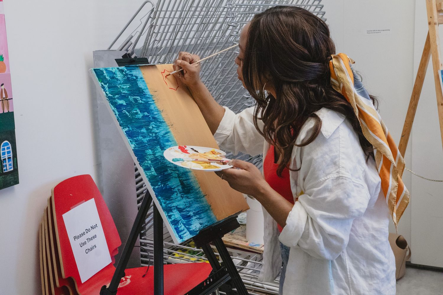 Instructor showing demonstration at paint night, captured by a Calgary event photographer
