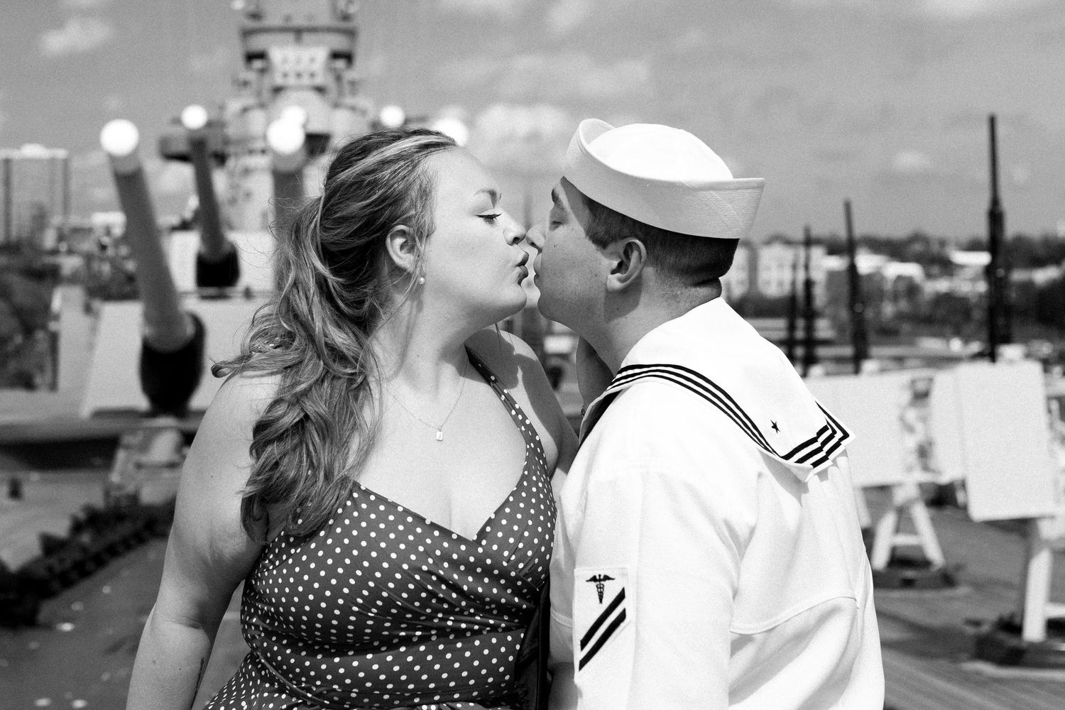 A series of black and white photos showing couples kissing in various romantic settings and poses.