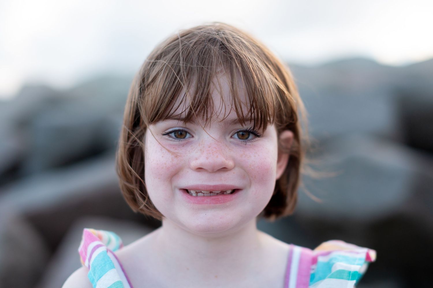 Close-up portrait series showing bright expressions and playful moments.