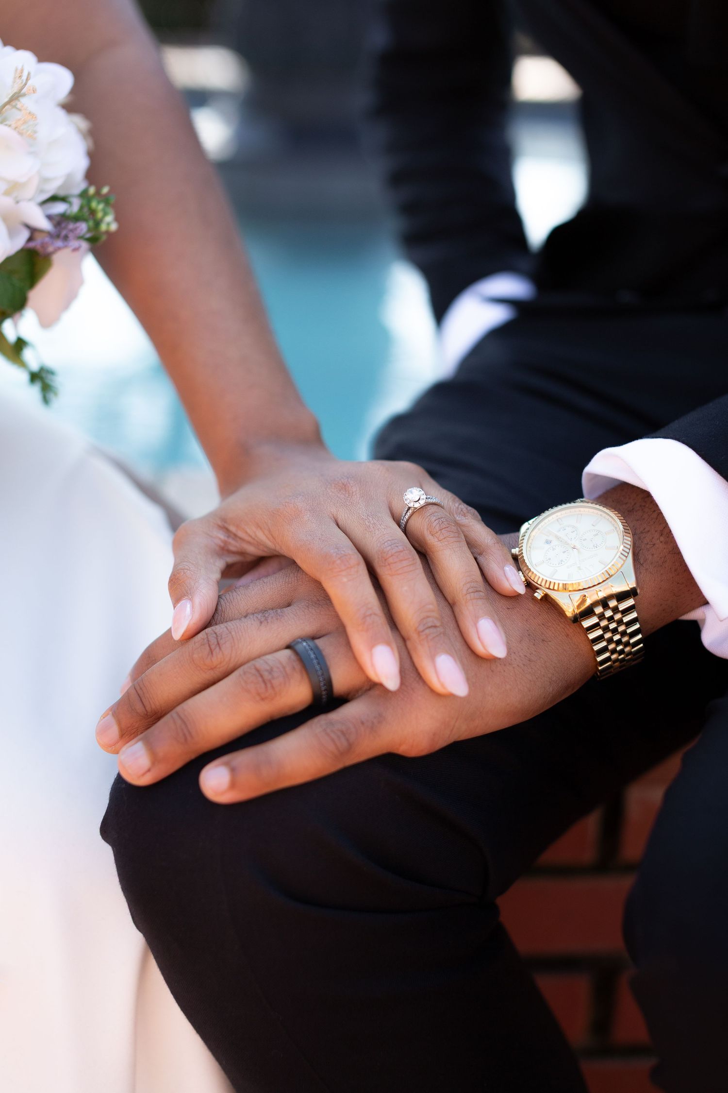 Close-up series of hands showing wedding rings and tender moments between newlyweds.
