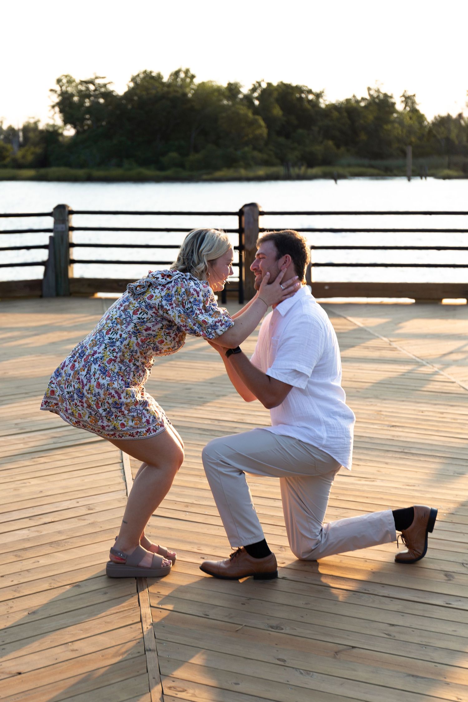 Sequence of a romantic proposal moment at sunset on a wooden deck overlooking water.