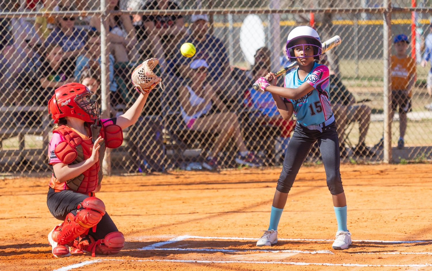 Youth baseball game showing multiple batting sequences with players at home plate.