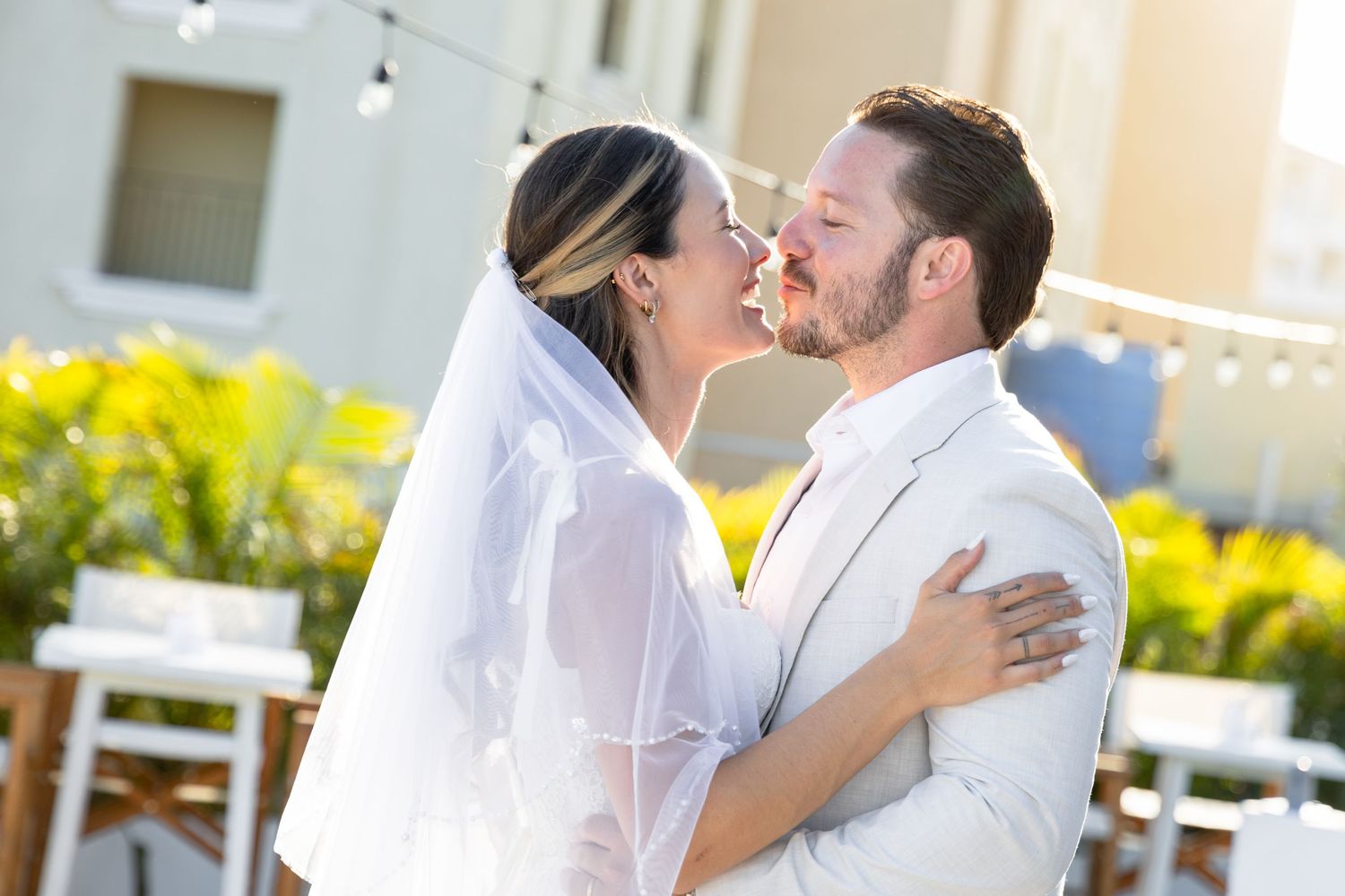 Romantic wedding moments captured in an outdoor setting with natural lighting.