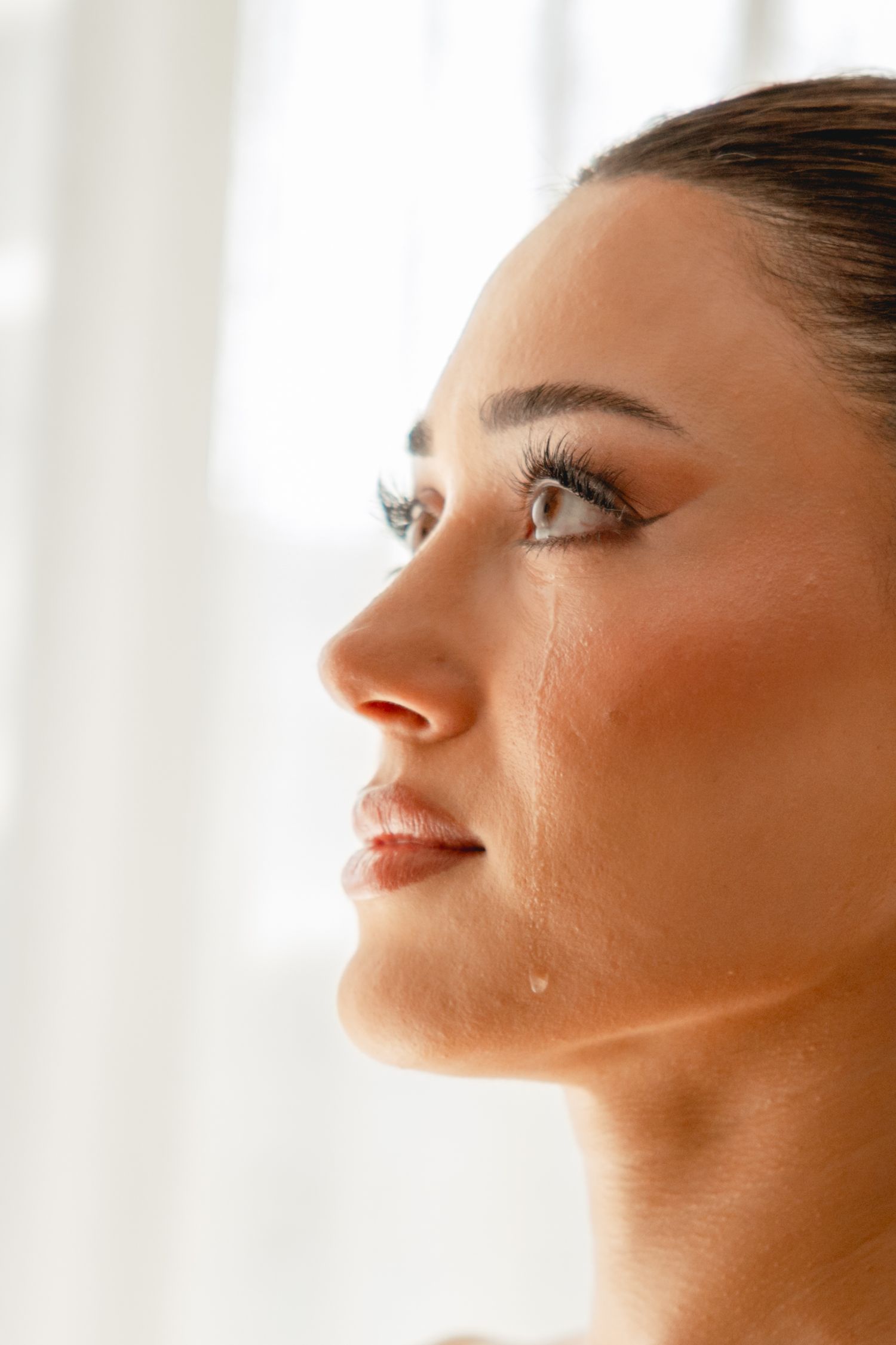 Close-up profile view showing gentle natural lighting and soft features.