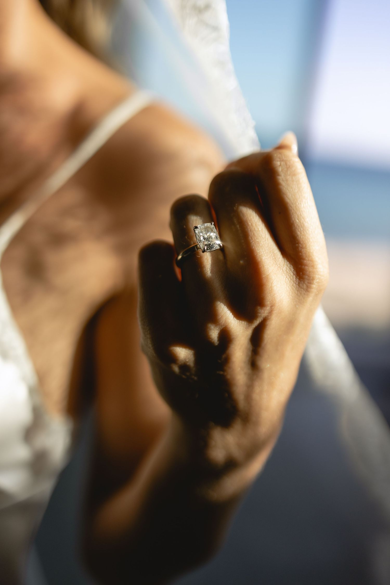Close-up shot of an engagement ring sparkling in natural light.