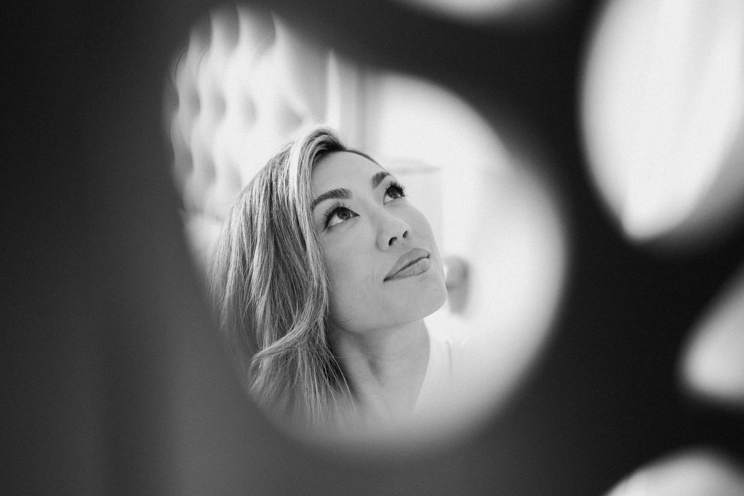 Artistic black and white portrait with dramatic lighting and soft focus effects.
