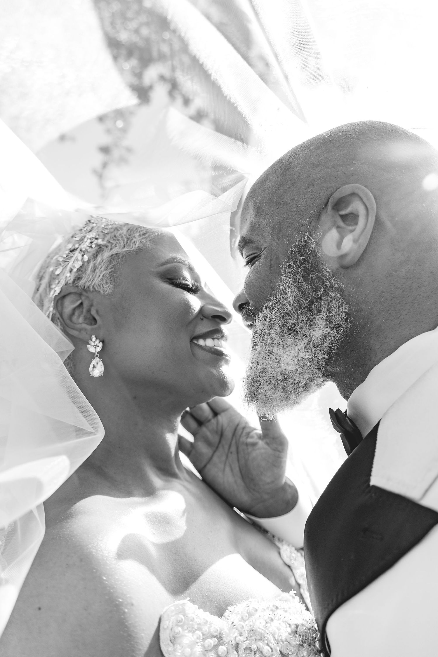 Black and white close-up photos showing tender romantic moments between newlyweds.