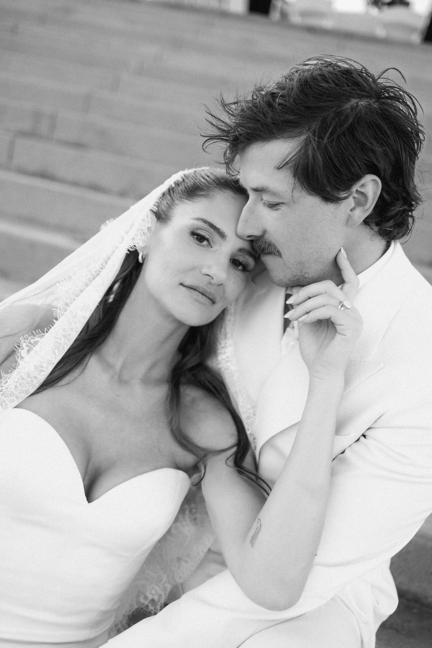 Black and white romantic wedding portraits showing intimate moments between newlyweds.