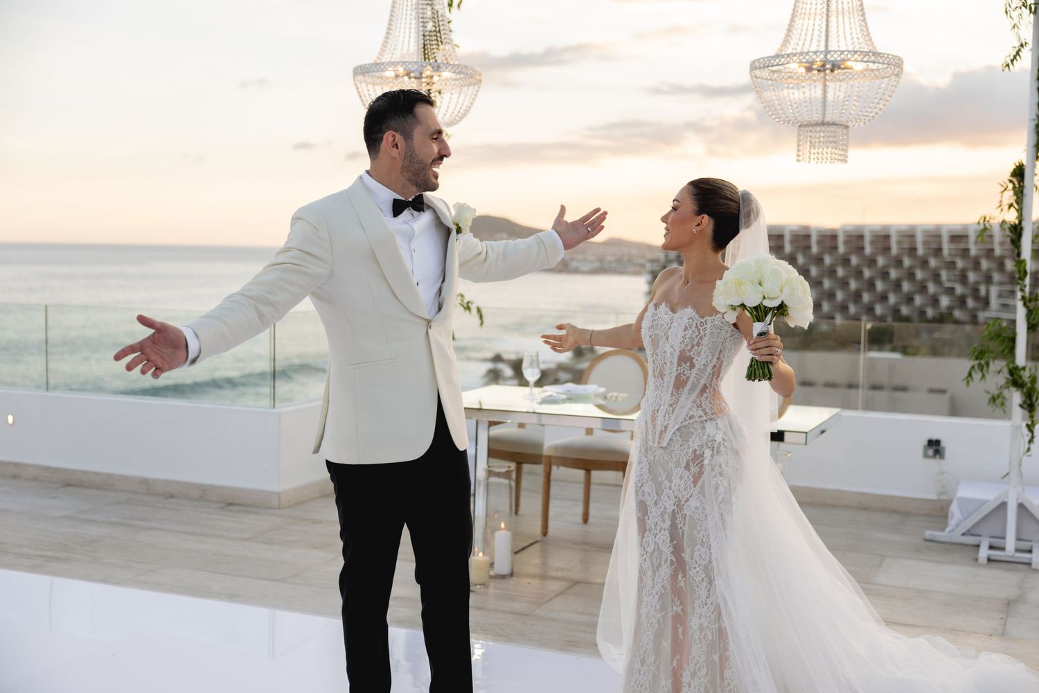Joyful wedding celebration moment captured on a scenic rooftop venue.
