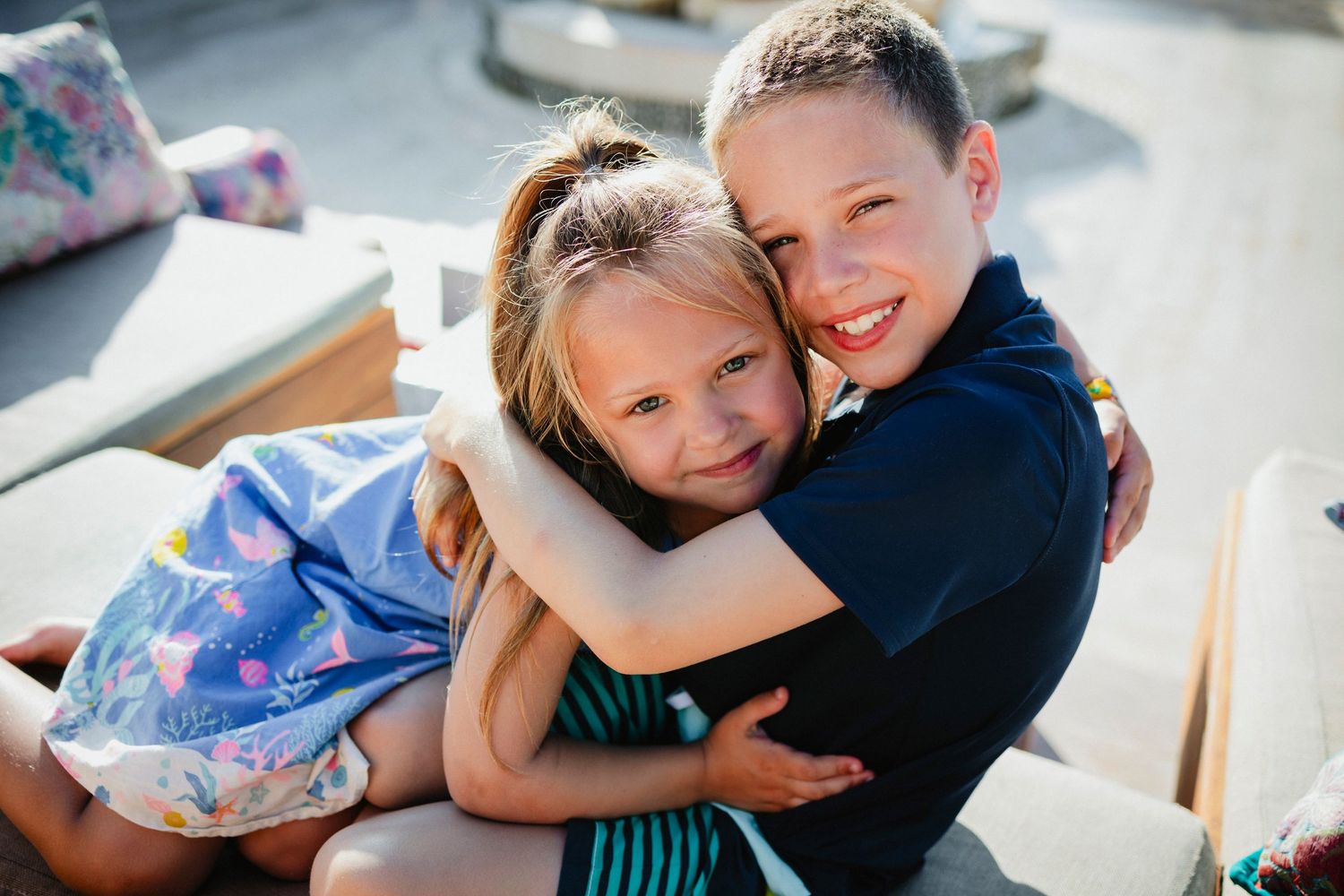 Candid hugging moments captured in a series of casual indoor lifestyle photos.