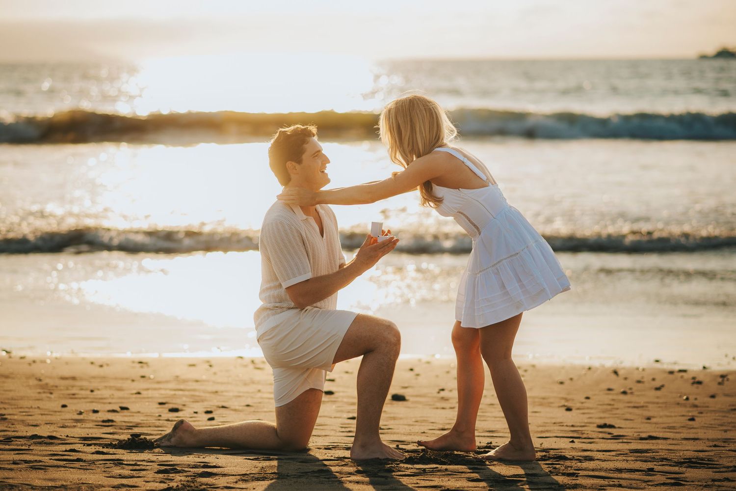 Intimate family interactions captured on a sunlit beach during golden hour.