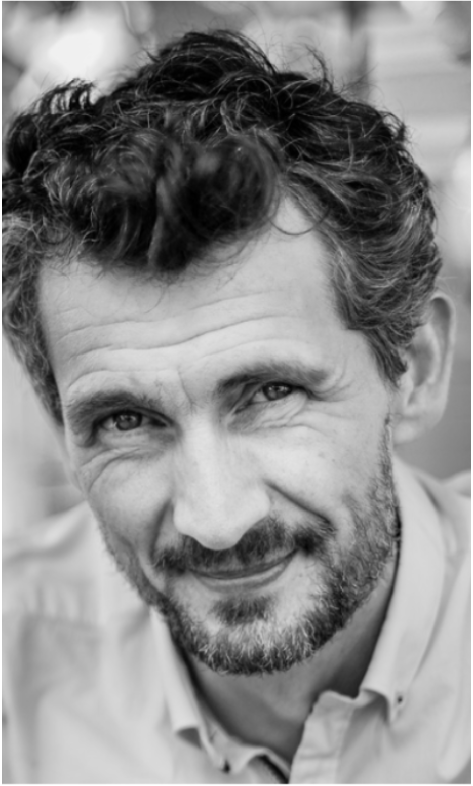 Black and white portrait series showing different facial expressions and angles of a bearded man in casual attire.